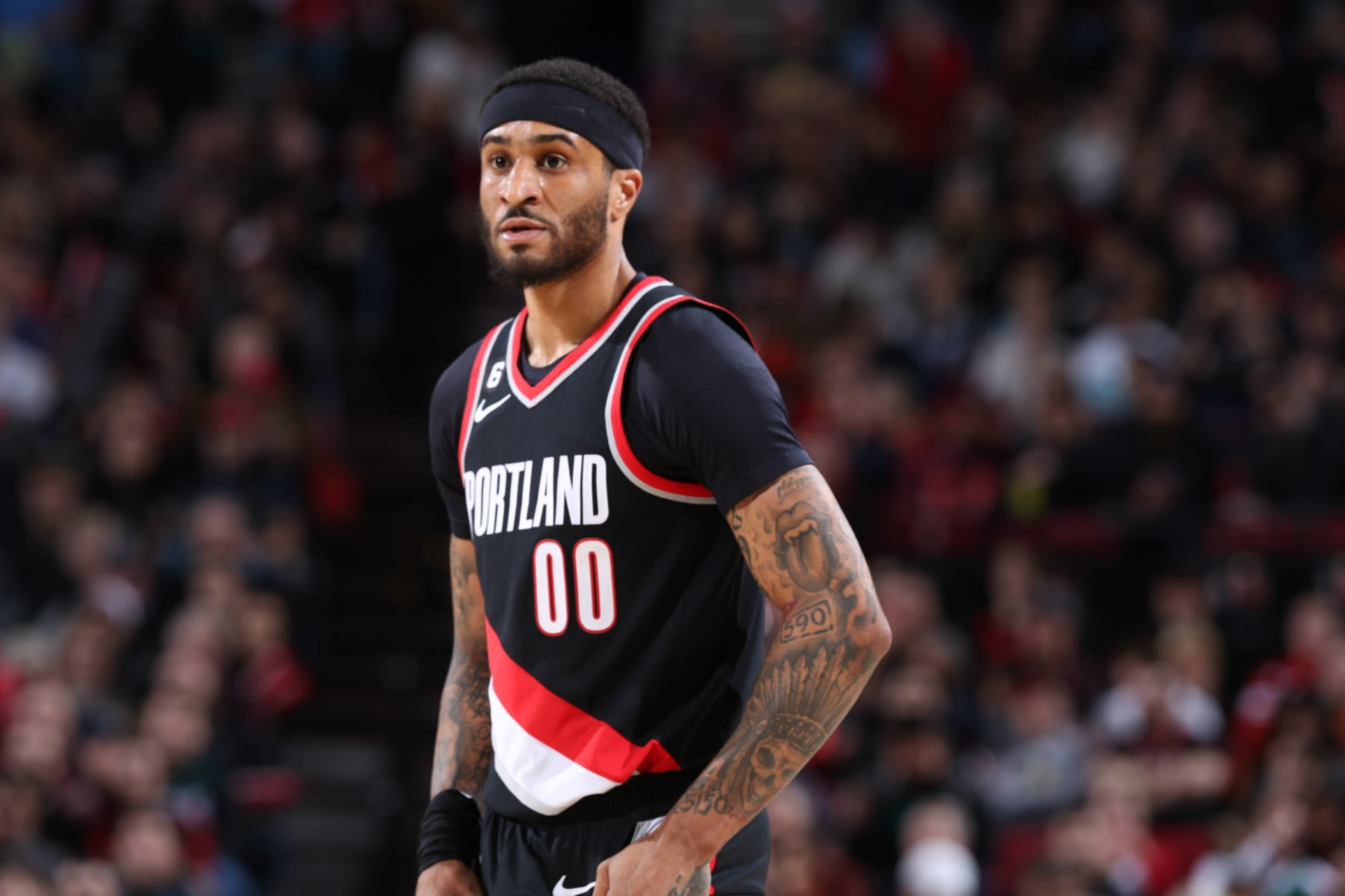 PORTLAND, OR - JANUARY 15: Gary Payton II #00 of the Portland Trail Blazers looks on during the game against the Dallas Mavericks on January 15, 2023 at the Moda Center Arena in Portland, Oregon. NOTE TO USER: User expressly acknowledges and agrees that, by downloading and or using this photograph, user is consenting to the terms and conditions of the Getty Images License Agreement. Mandatory Copyright Notice: Copyright 2022 NBAE (Photo by Sam Forencich/NBAE via Getty Images)