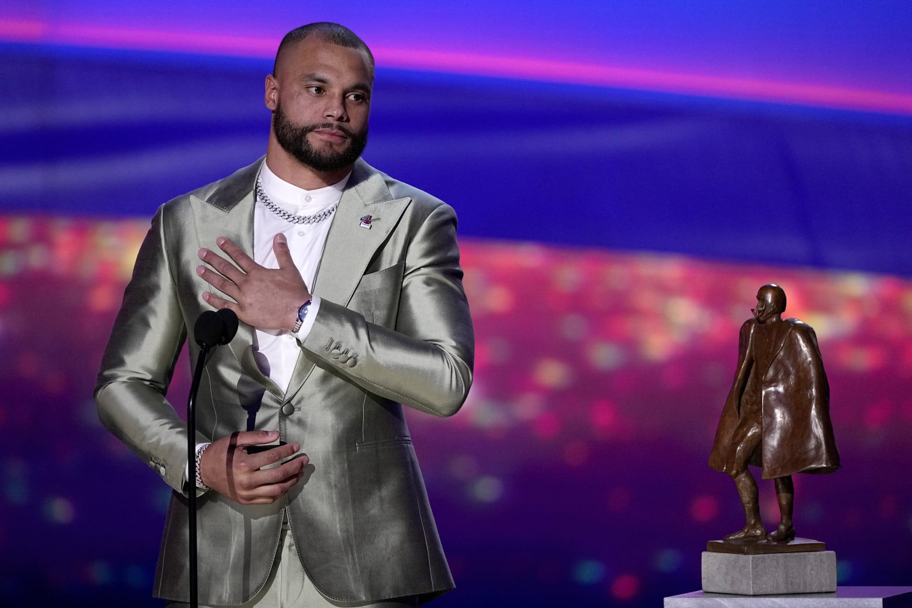 Walter Payton Player of the Year Award winner, Dallas Cowboys' Dak Prescott, gestures during the NFL Honors award show ahead of the Super Bowl 57 football game, Thursday, Feb. 9, 2023, in Phoenix. (AP Photo/David J. Phillip)