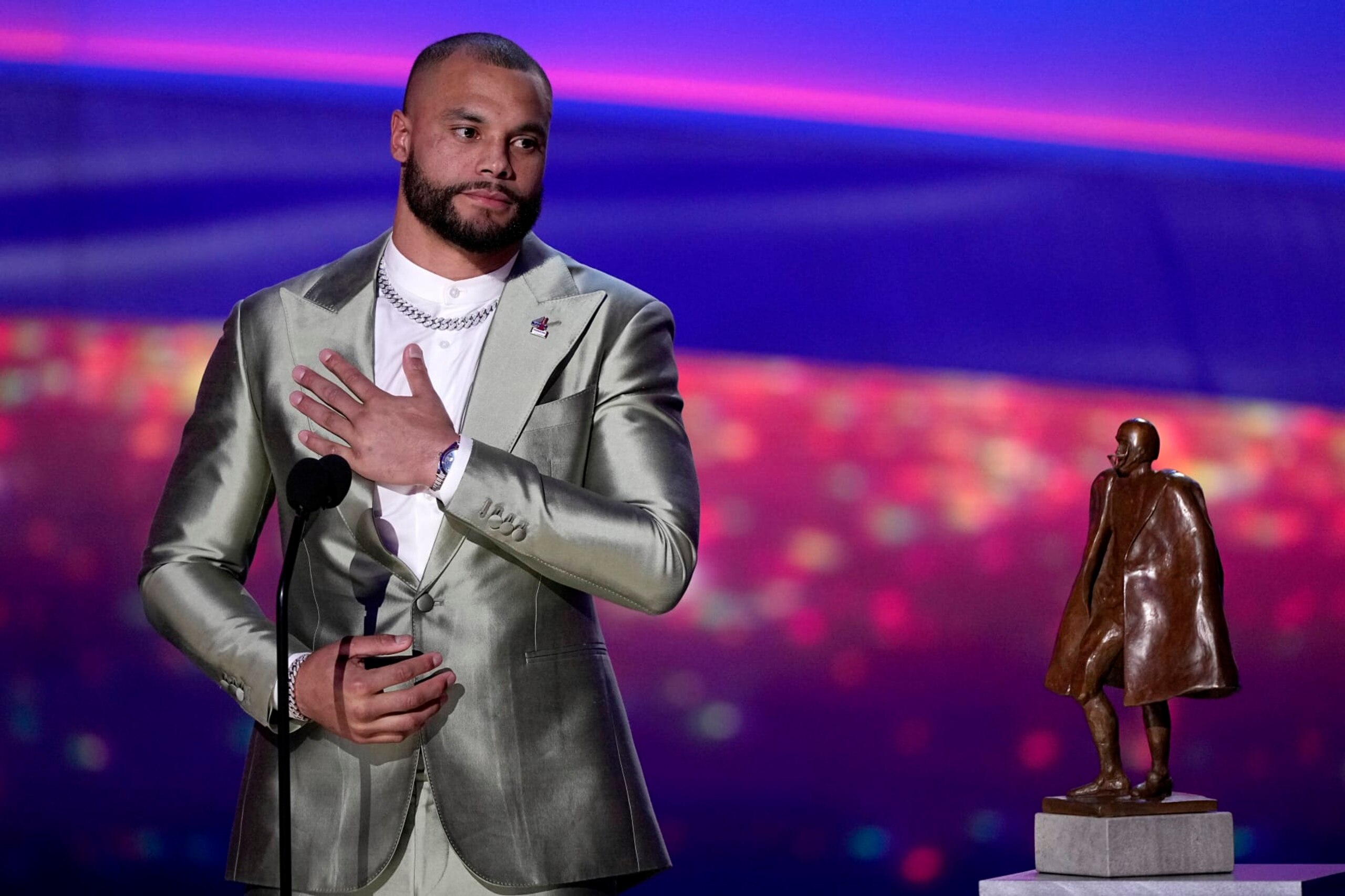 Walter Payton Player of the Year Award winner, Dallas Cowboys' Dak Prescott, gestures during the NFL Honors award show ahead of the Super Bowl 57 football game, Thursday, Feb. 9, 2023, in Phoenix. (AP Photo/David J. Phillip) Walter Payton Player of the Year Award winner, Dallas Cowboys' Dak Prescott, gestures during the NFL Honors award show ahead of the Super Bowl 57 football game, Thursday, Feb. 9, 2023, in Phoenix. (AP Photo/David J. Phillip)