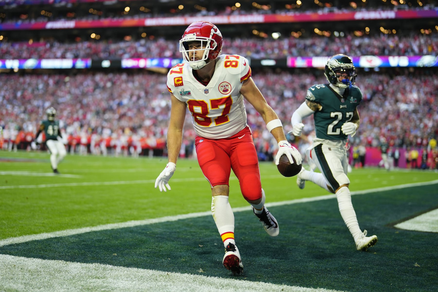 Kansas City Chiefs tight end Travis Kelce (87) celebrates after scoring a touchdown during the first half of the NFL Super Bowl 57 football game between the Kansas City Chiefs and the Philadelphia Eagles, Sunday, Feb. 12, 2023, in Glendale, Ariz. (AP Photo/Matt Slocum)