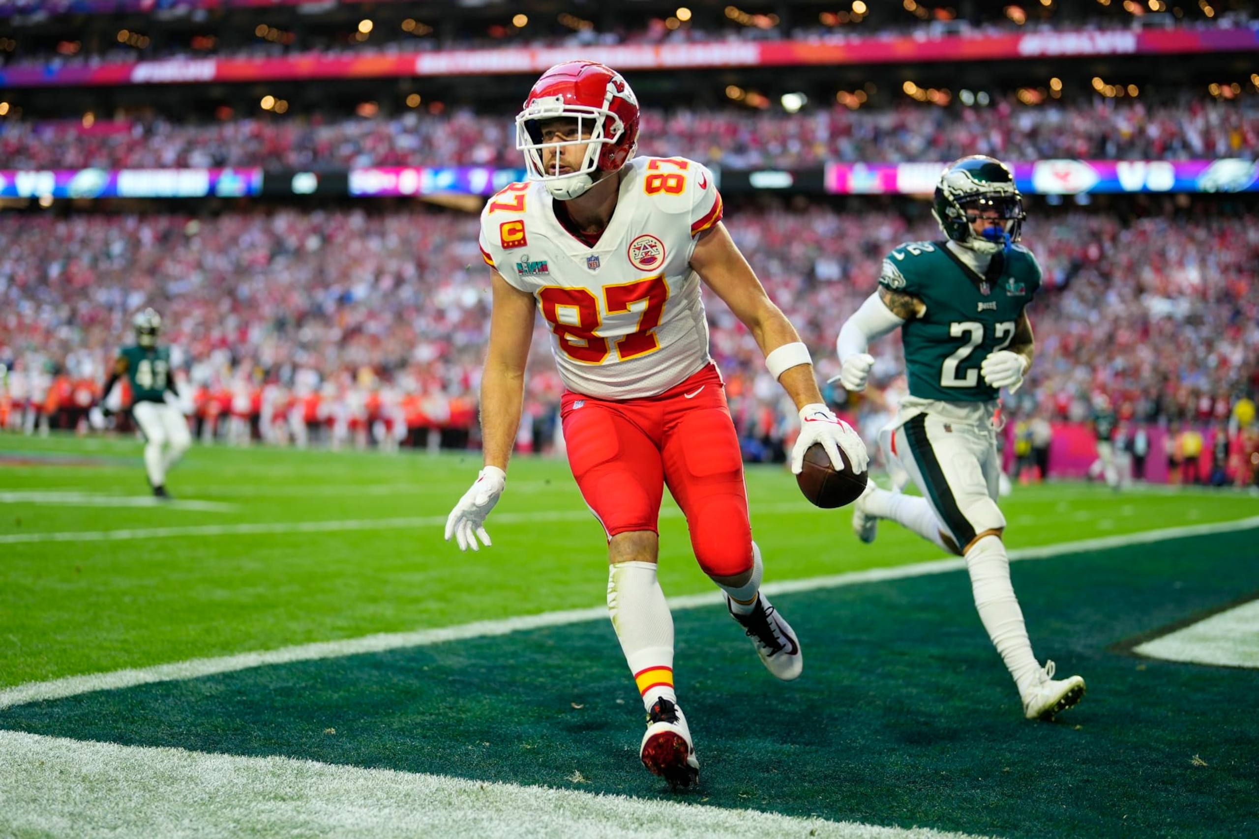 Kansas City Chiefs tight end Travis Kelce (87) celebrates after scoring a touchdown during the first half of the NFL Super Bowl 57 football game between the Kansas City Chiefs and the Philadelphia Eagles, Sunday, Feb. 12, 2023, in Glendale, Ariz. (AP Photo/Matt Slocum)