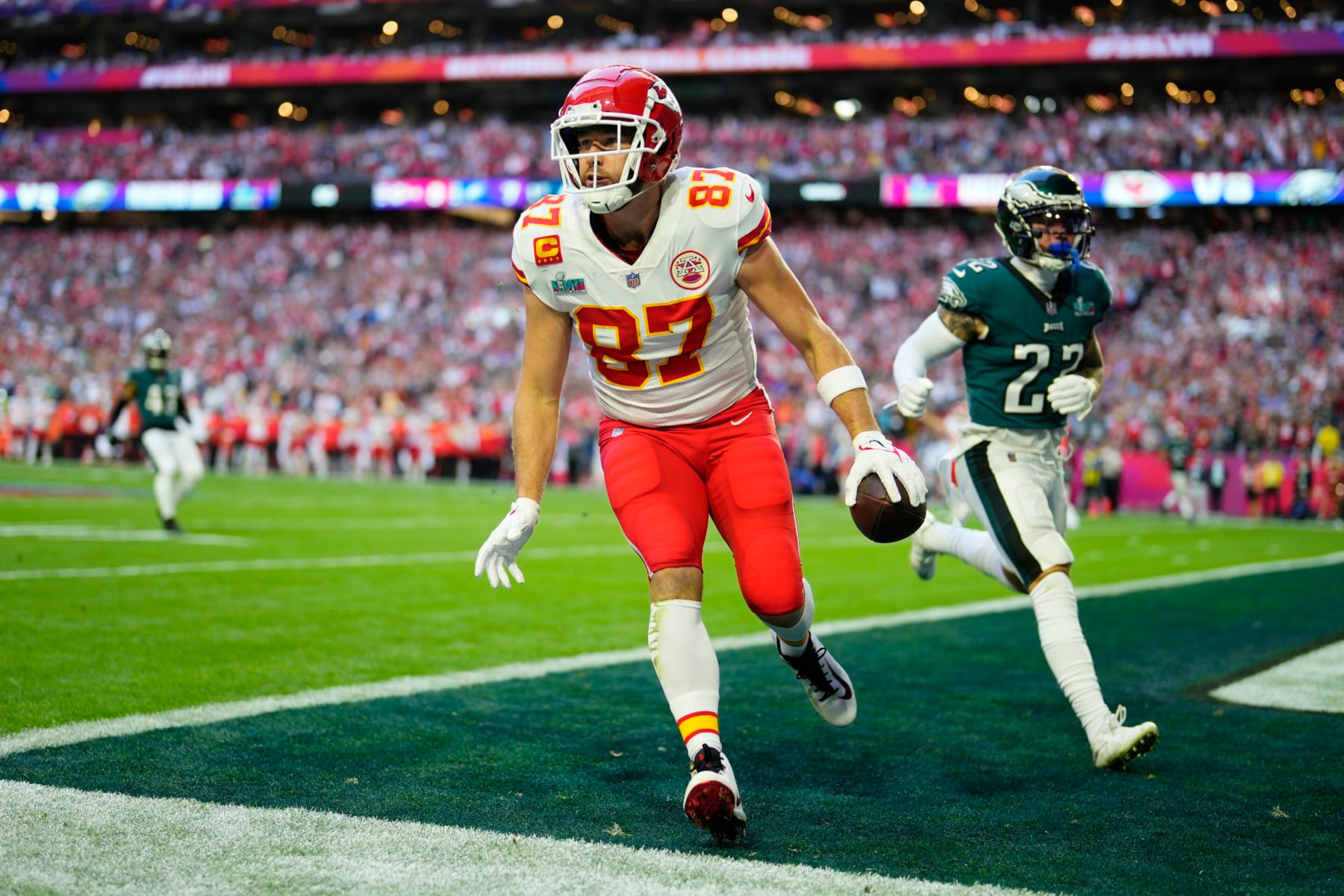 Kansas City Chiefs tight end Travis Kelce (87) celebrates after scoring a touchdown during the first half of the NFL Super Bowl 57 football game between the Kansas City Chiefs and the Philadelphia Eagles, Sunday, Feb. 12, 2023, in Glendale, Ariz. (AP Photo/Matt Slocum)