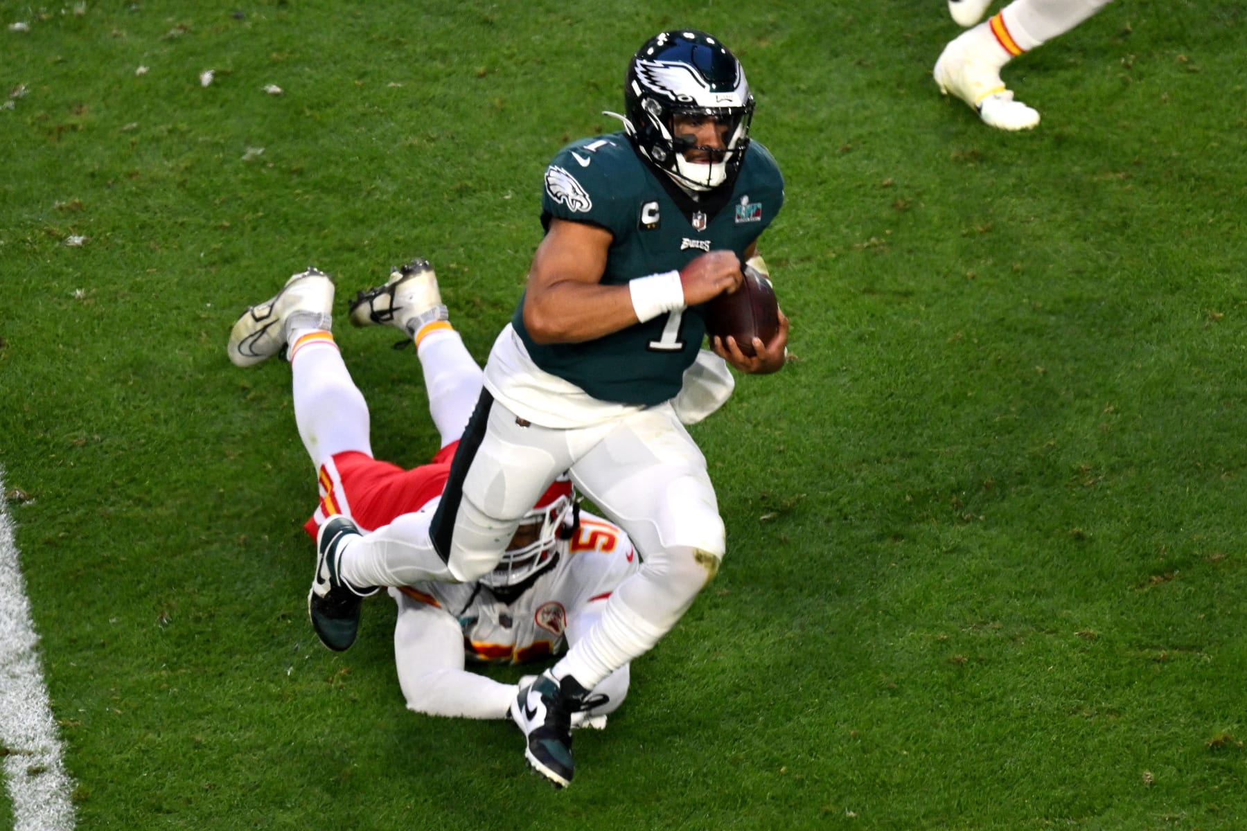 Philadelphia Eagles' quarterback Jalen Hurts runs with the ball during Super Bowl LVII between the Kansas City Chiefs and the Philadelphia Eagles at State Farm Stadium in Glendale, Arizona, on February 12, 2023. (Photo by ANGELA WEISS / AFP) (Photo by ANGELA WEISS/AFP via Getty Images)