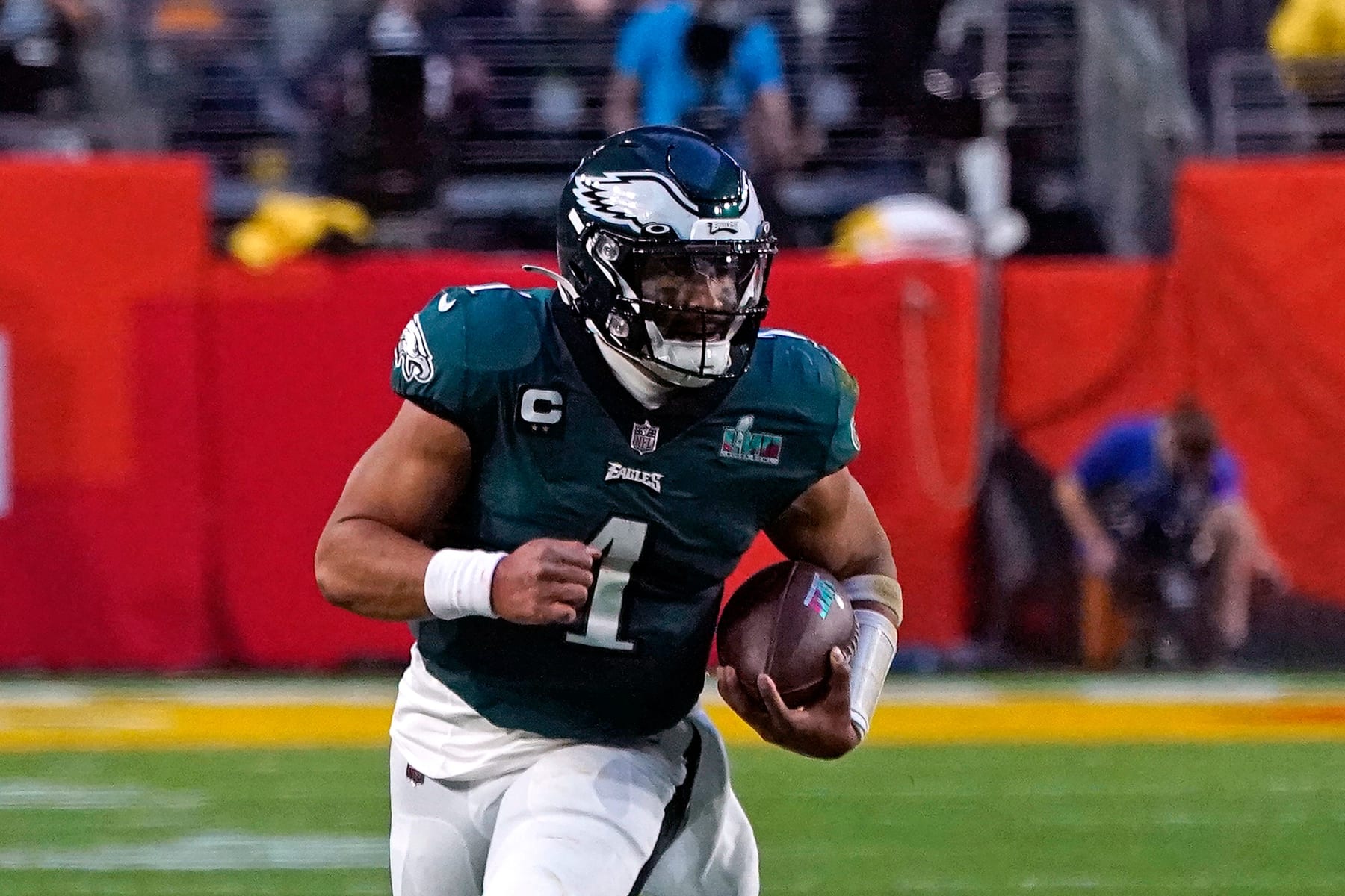 Philadelphia Eagles' quarterback Jalen Hurts runs with the ball during Super Bowl LVII between the Kansas City Chiefs and the Philadelphia Eagles at State Farm Stadium in Glendale, Arizona, on February 12, 2023. (Photo by TIMOTHY A. CLARY / AFP) (Photo by TIMOTHY A. CLARY/AFP via Getty Images)