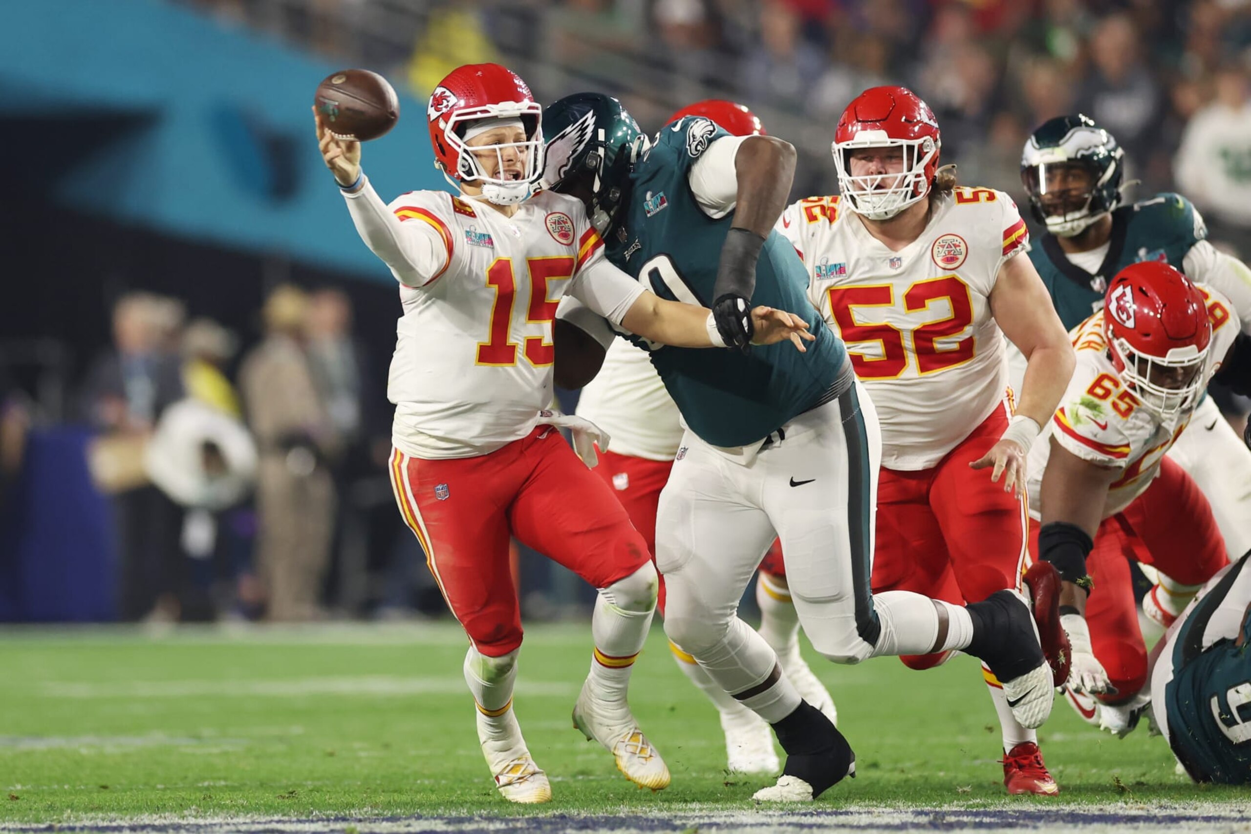 GLENDALE, ARIZONA - FEBRUARY 12: Patrick Mahomes #15 of the Kansas City Chiefs scrambles away from Jordan Davis #90 of the Philadelphia Eagles during the third quarter in Super Bowl LVII at State Farm Stadium on February 12, 2023 in Glendale, Arizona. (Photo by Christian Petersen/Getty Images)