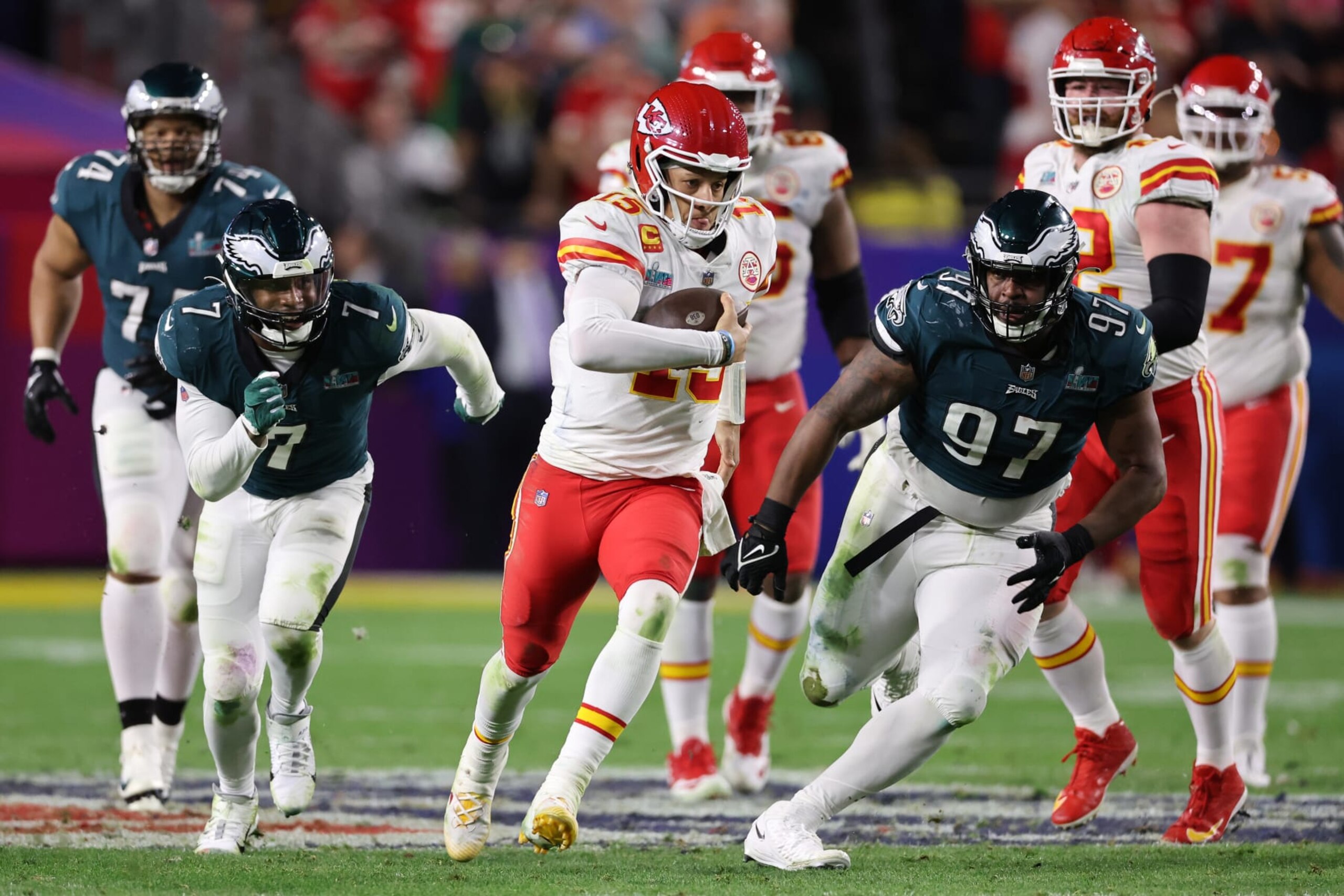 GLENDALE, ARIZONA - FEBRUARY 12: Patrick Mahomes #15 of the Kansas City Chiefs runs the ball against Javon Hargrave #97 of the Philadelphia Eagles during the fourth quarter  in Super Bowl LVII at State Farm Stadium on February 12, 2023 in Glendale, Arizona. (Photo by Gregory Shamus/Getty Images)