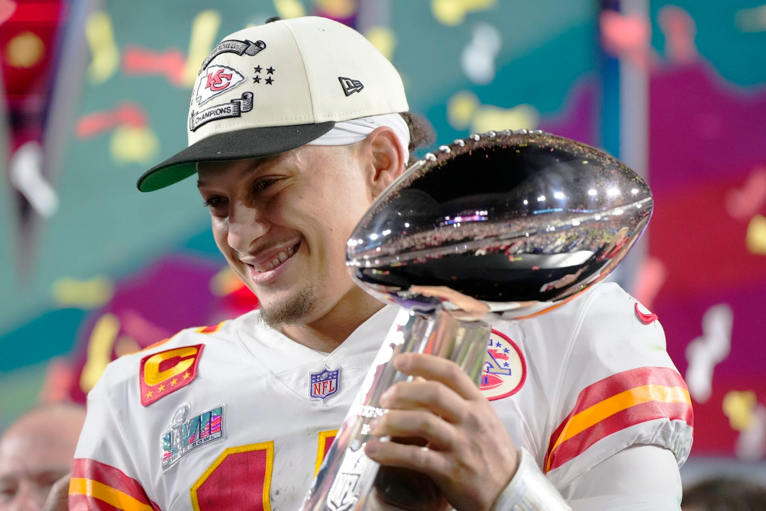 Kansas City Chiefs quarterback Patrick Mahomes (15) holds the trophy after their win against the Philadelphia Eagles in the NFL Super Bowl 57 football game, Sunday, Feb. 12, 2023, in Glendale, Ariz. The Kansas City Chiefs defeated the Philadelphia Eagles 38-35. (AP Photo/Matt Slocum)