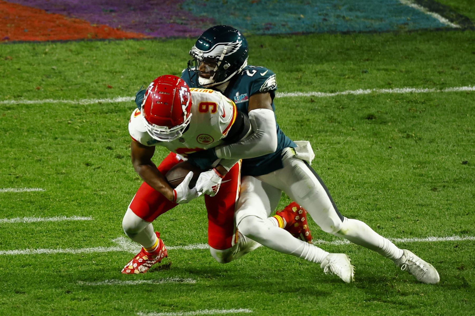 GLENDALE, AZ - FEBRUARY 12: James Bradberry #24 of the Philadelphia Eagles tackles JuJu Smith-Schuster #9 of the Kansas City Chiefs during the fourth quarter in Super Bowl LVII at State Farm Stadium on February 12, 2023 in Glendale, Arizona. (Photo by Kevin Sabitus/Getty Images)