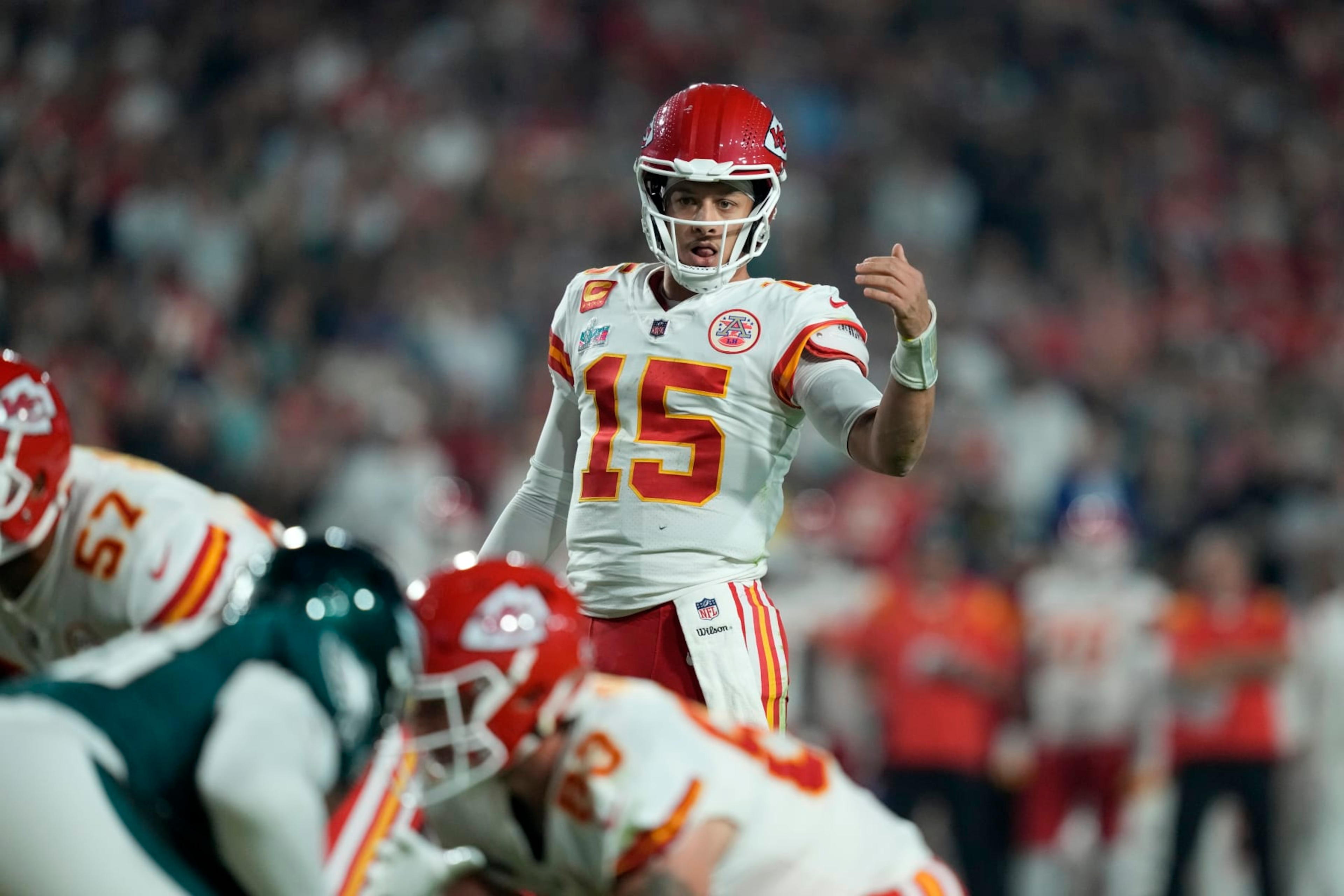 Kansas City Chiefs quarterback Patrick Mahomes (15) calls signals at the line of scrimmage against the Philadelphia Eagles during the NFL Super Bowl 57 football game, Sunday, Feb. 12, 2023, in Glendale, Ariz. (AP Photo/Steve Luciano)