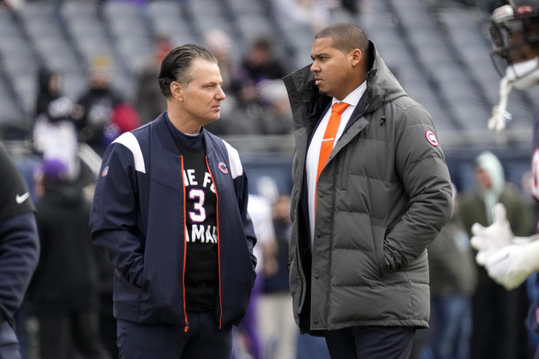 Chicago Bears head coach Matt Eberflus talks with Bears general manager Ryan Poles, right, before an NFL football game against the Minnesota Vikings, Sunday, Jan. 8, 2023, in Chicago. (AP Photo/Nam Y. Huh)