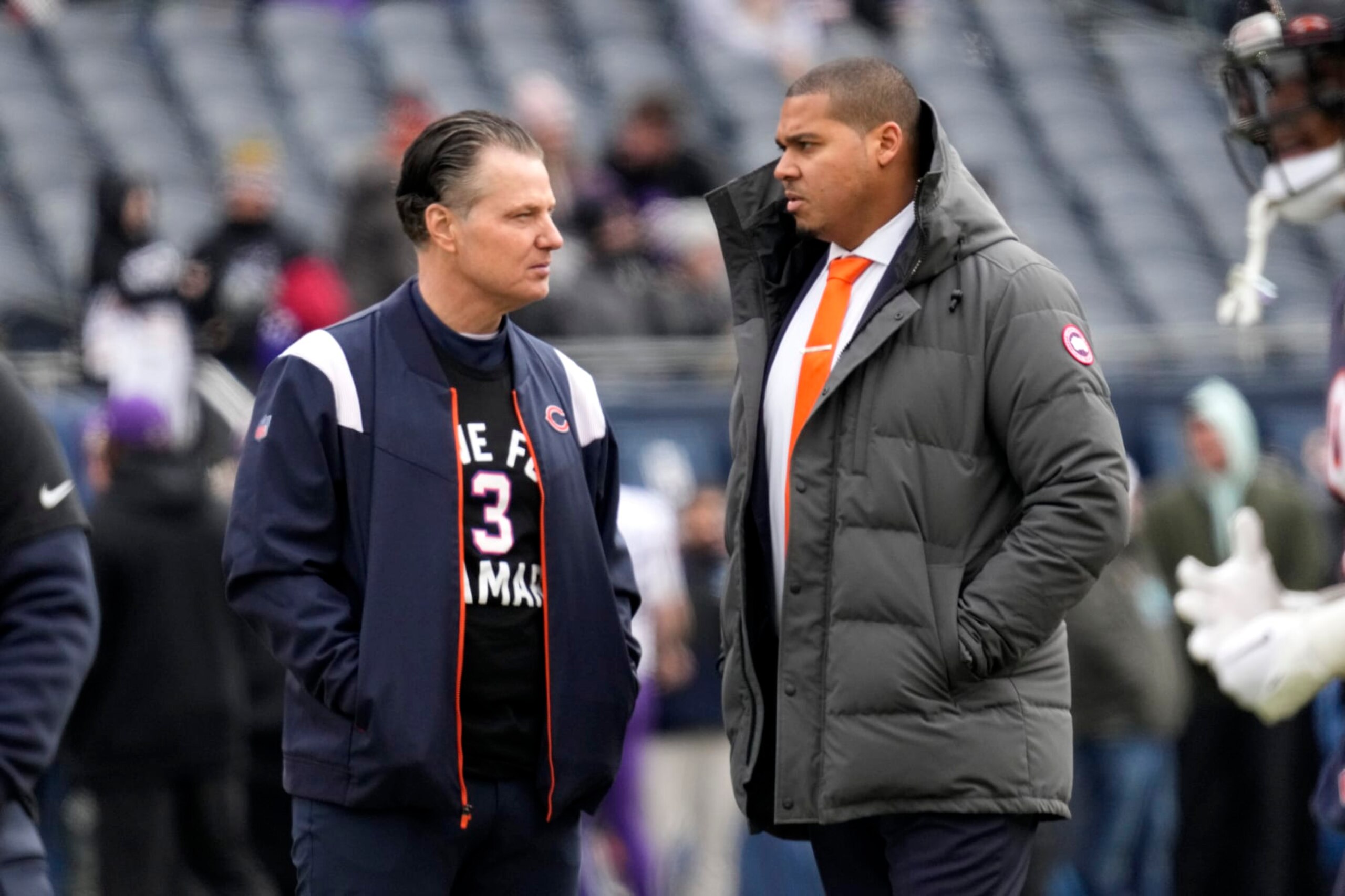 Chicago Bears head coach Matt Eberflus talks with Bears general manager Ryan Poles, right, before an NFL football game against the Minnesota Vikings, Sunday, Jan. 8, 2023, in Chicago. (AP Photo/Nam Y. Huh)