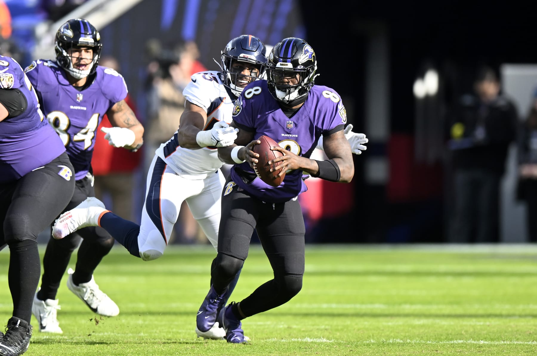 BALTIMORE, MARYLAND - DECEMBER 04: Lamar Jackson #8 of the Baltimore Ravens is sacked by Jonathon Cooper #53 of the Denver Broncos at M&T Bank Stadium on December 04, 2022 in Baltimore, Maryland. (Photo by G Fiume/Getty Images)