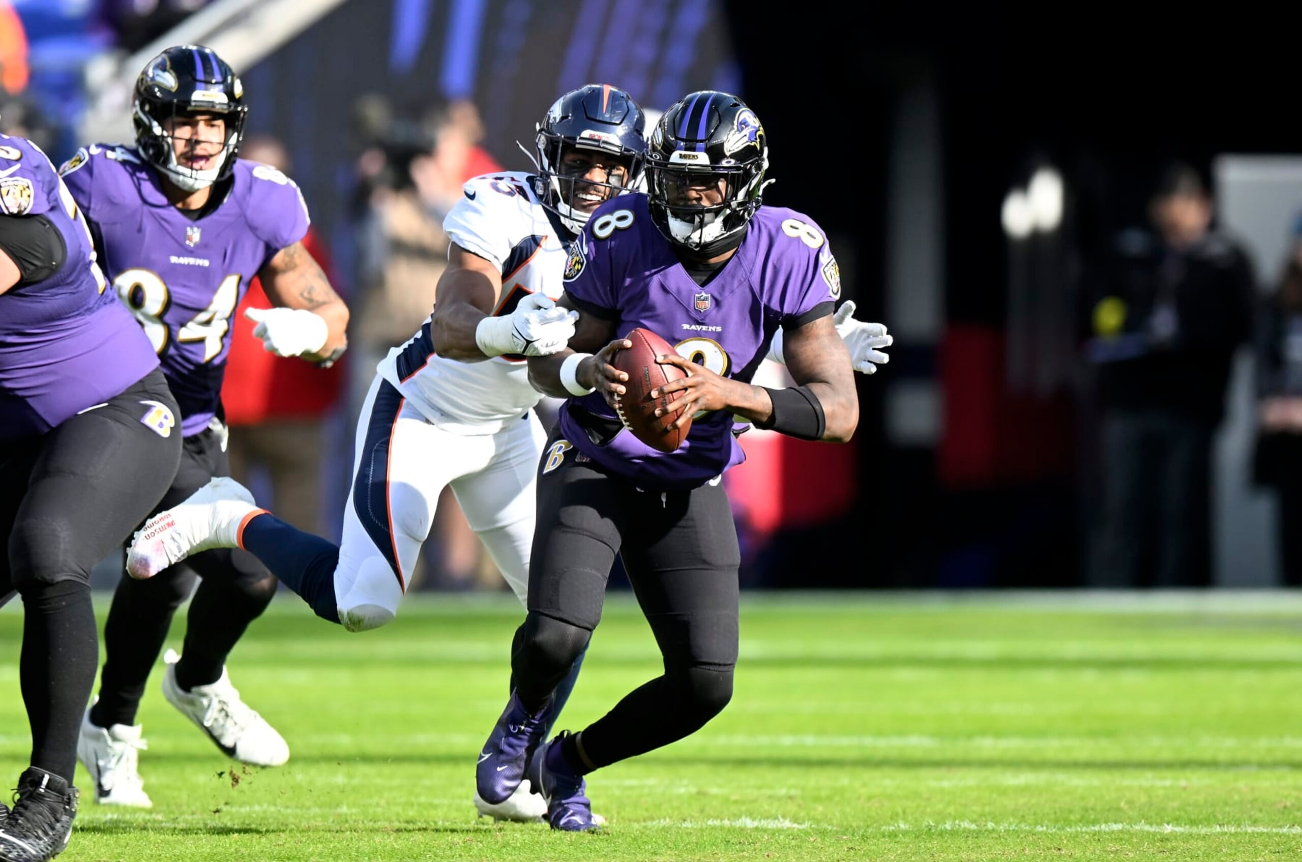 BALTIMORE, MARYLAND - DECEMBER 04: Lamar Jackson #8 of the Baltimore Ravens is sacked by Jonathon Cooper #53 of the Denver Broncos at M&T Bank Stadium on December 04, 2022 in Baltimore, Maryland. (Photo by G Fiume/Getty Images)