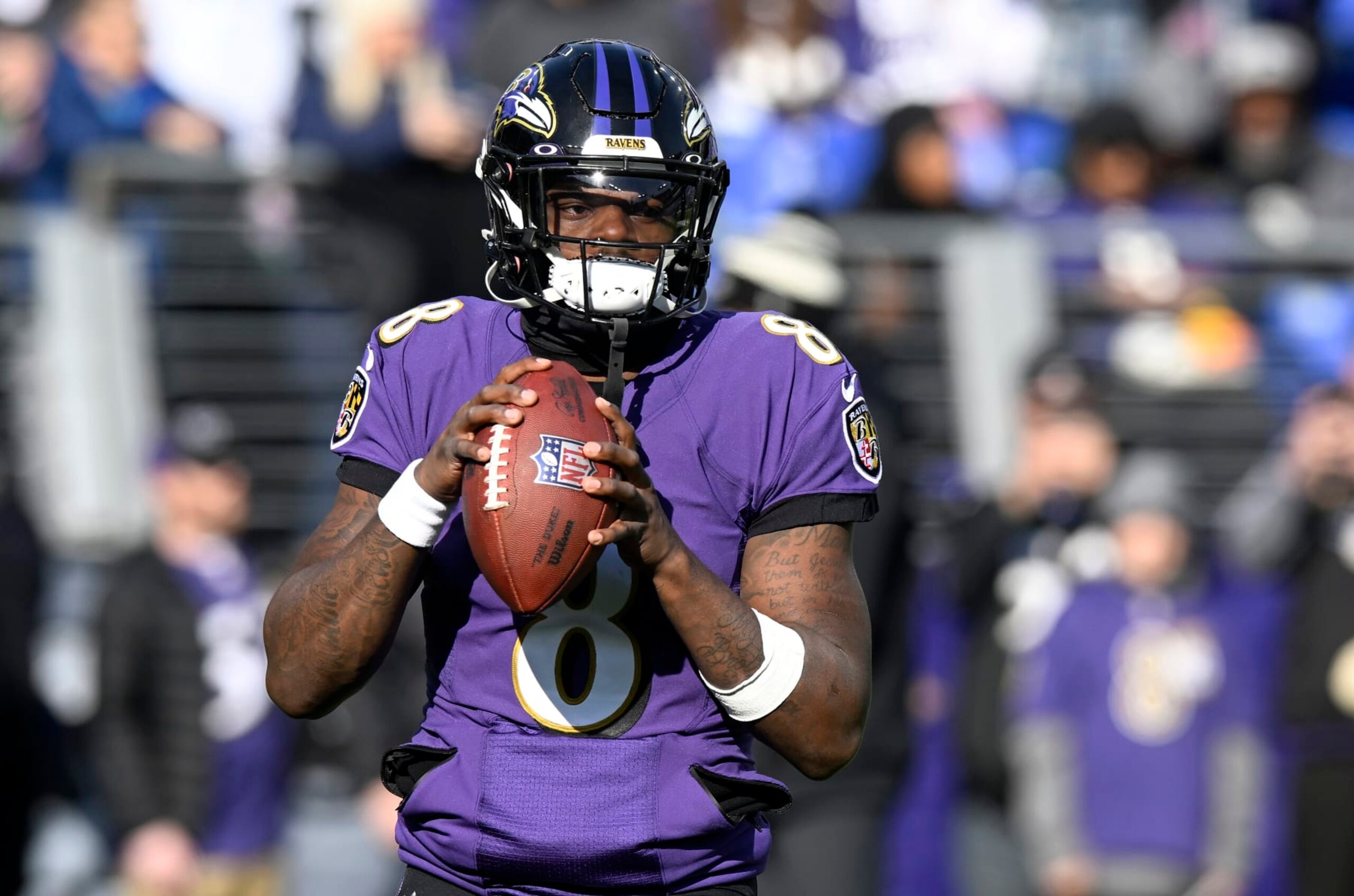 BALTIMORE, MARYLAND - DECEMBER 04: Lamar Jackson #8 of the Baltimore Ravens warms up before the game against the Denver Broncos at M&T Bank Stadium on December 04, 2022 in Baltimore, Maryland. (Photo by G Fiume/Getty Images)