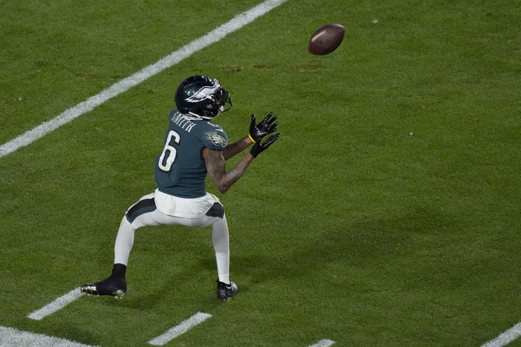 Philadelphia Eagles wide receiver DeVonta Smith (6) pulls in a pass for a first down against the Kansas City Chiefs during the second half of the NFL Super Bowl 57 football game, Sunday, Feb. 12, 2023, in Glendale, Ariz. (AP Photo/Charlie Riedel)