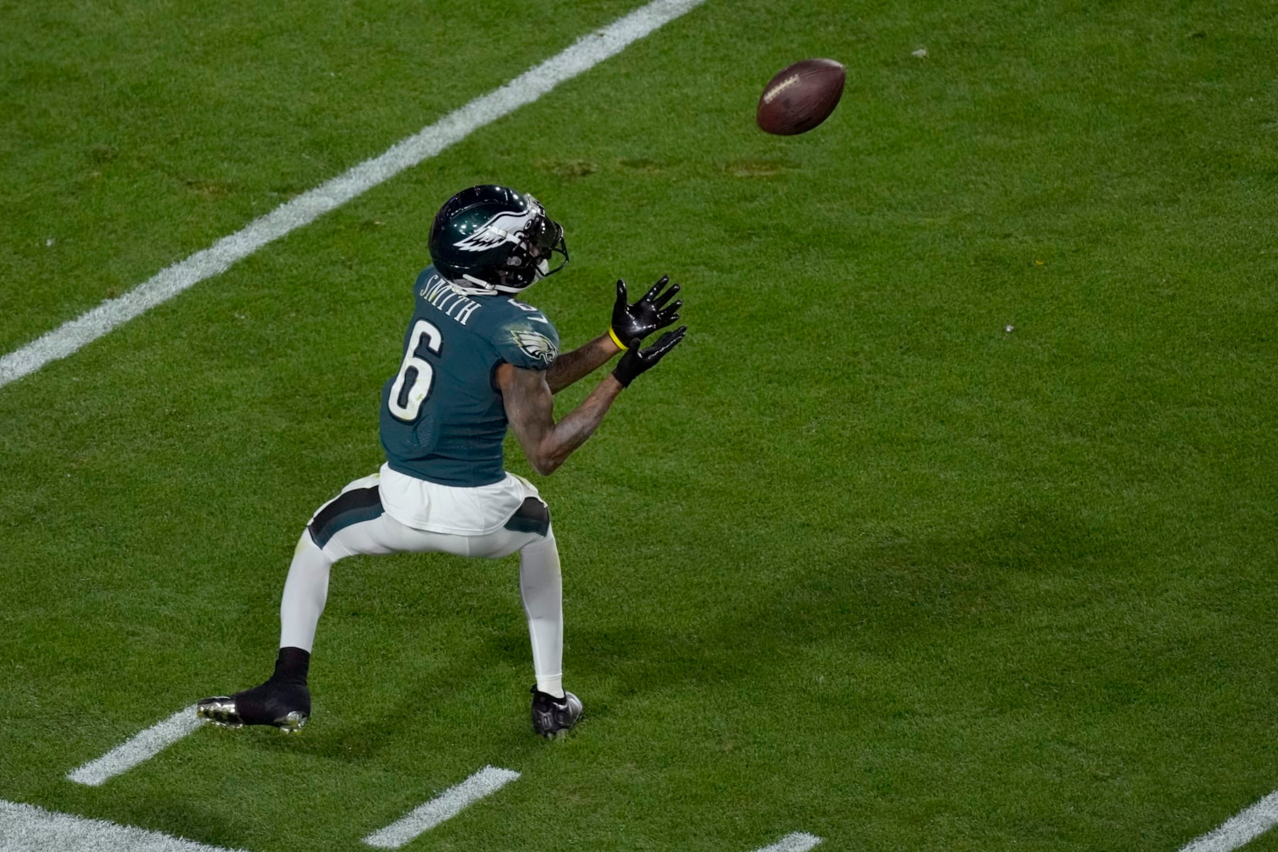 Philadelphia Eagles wide receiver DeVonta Smith (6) pulls in a pass for a first down against the Kansas City Chiefs during the second half of the NFL Super Bowl 57 football game, Sunday, Feb. 12, 2023, in Glendale, Ariz. (AP Photo/Charlie Riedel)