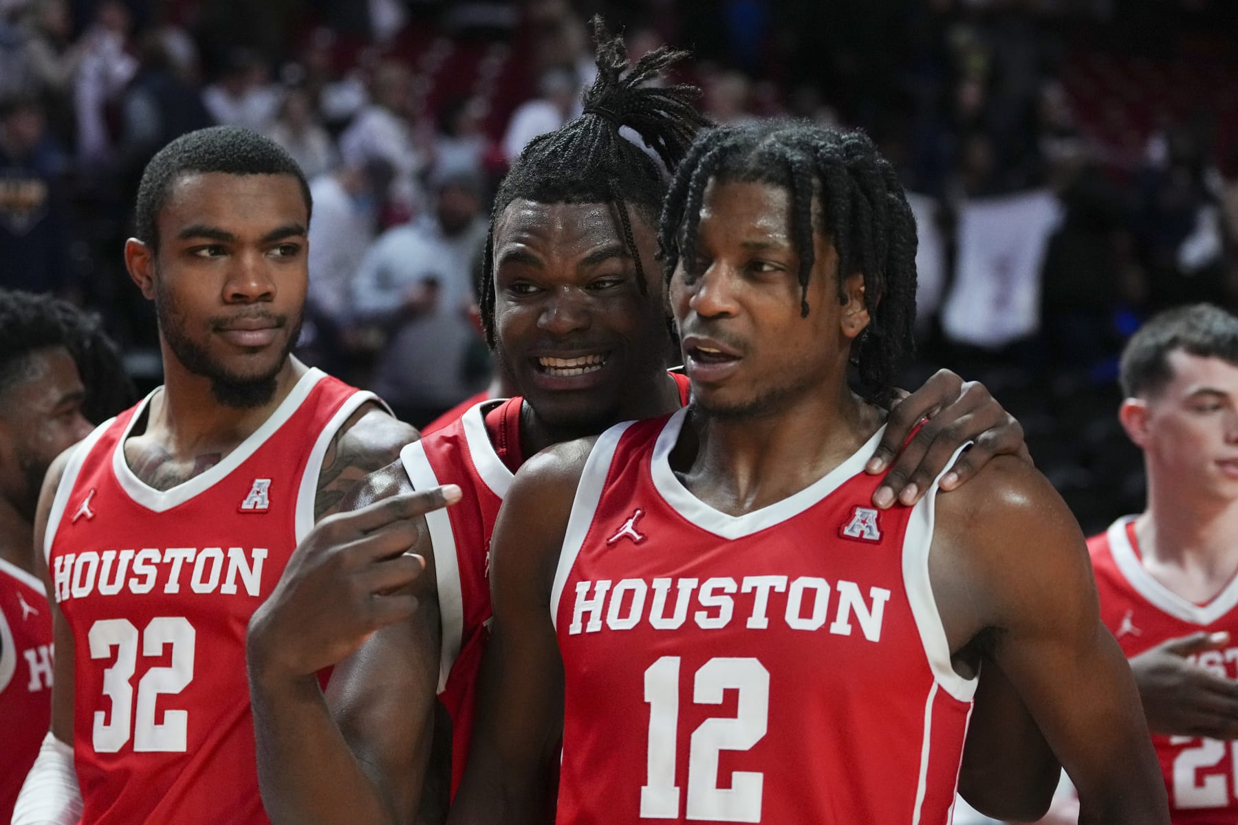 PHILADELPHIA, PA - FEBRUARY 05: Reggie Chaney #32, Jarace Walker #25, and Tramon Mark #12 of the Houston Cougars react after the game against the Temple Owls at the Liacouras Center on February 5, 2023 in Philadelphia, Pennsylvania. The Houston Cougars defeated the Temple Owls 81-65. (Photo by Mitchell Leff/Getty Images)