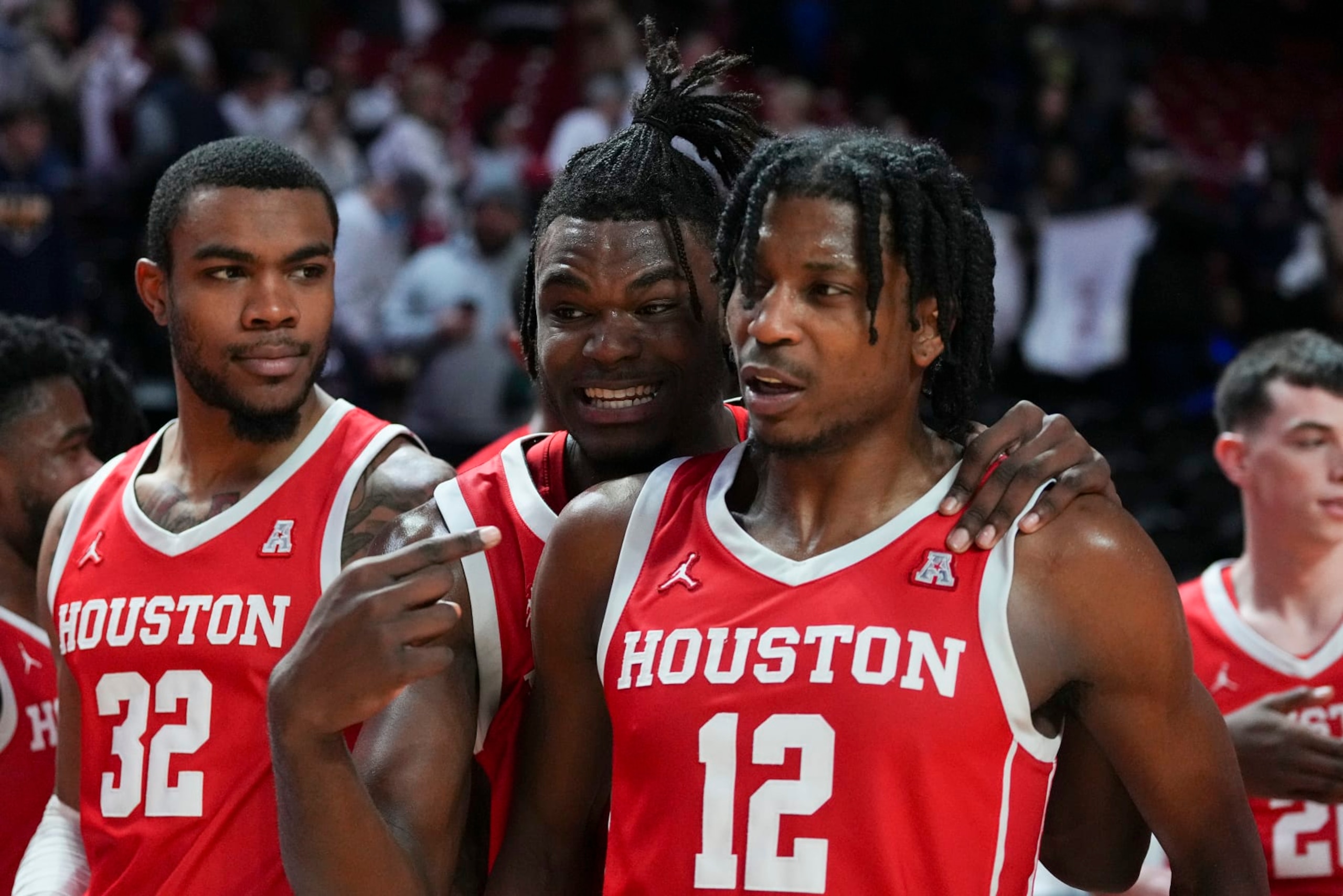 PHILADELPHIA, PA - FEBRUARY 05: Reggie Chaney #32, Jarace Walker #25, and Tramon Mark #12 of the Houston Cougars react after the game against the Temple Owls at the Liacouras Center on February 5, 2023 in Philadelphia, Pennsylvania. The Houston Cougars defeated the Temple Owls 81-65. (Photo by Mitchell Leff/Getty Images)