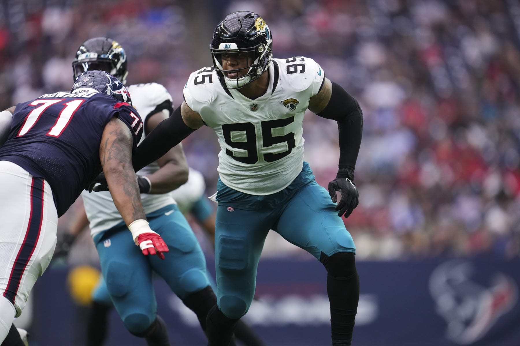 HOUSTON, TX - JANUARY 01: Roy Robertson-Harris #95 of the Jacksonville Jaguars defends against the Houston Texans at NRG Stadium on January 1, 2023 in Houston, Texas. (Photo by Cooper Neill/Getty Images)