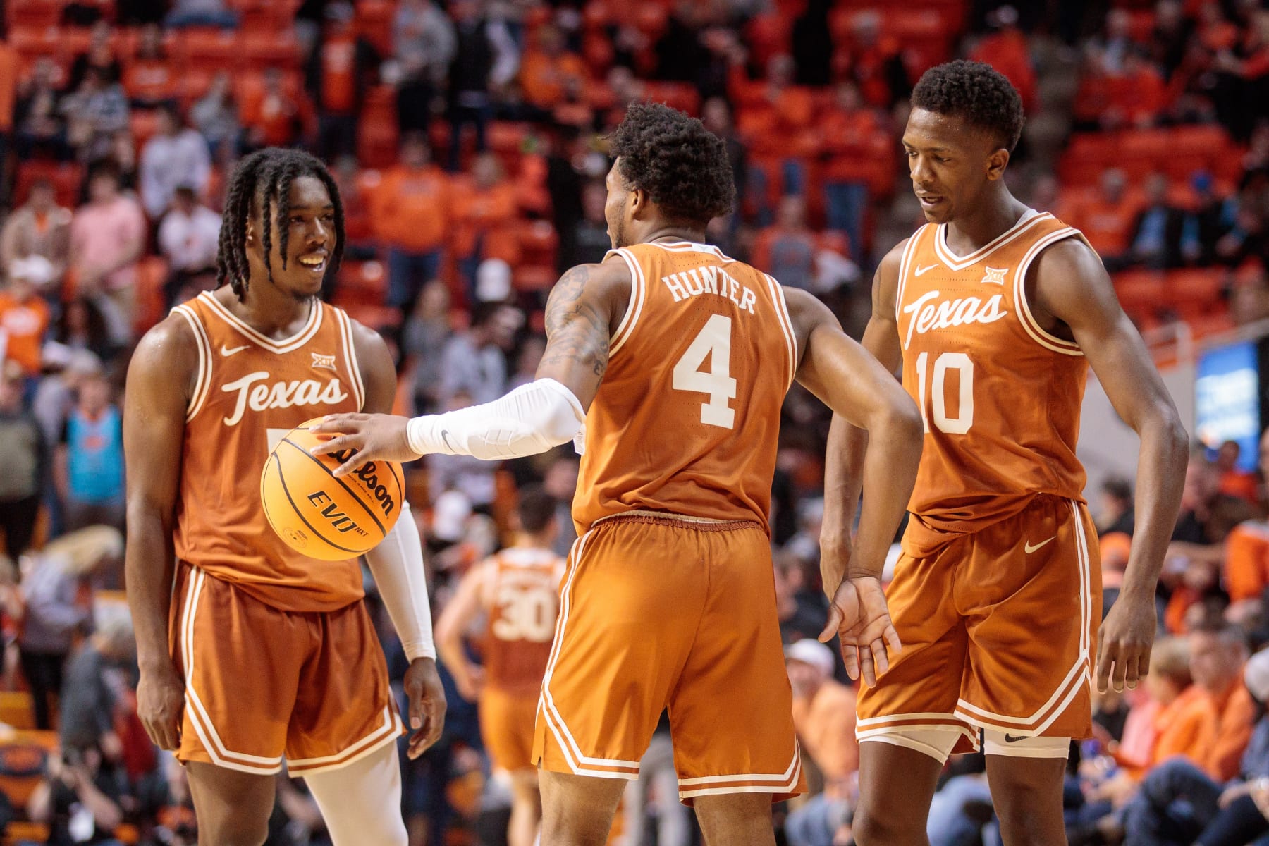 STILLWATER, OK - JANUARY 07: Texas Longhorns guard Marcus Carr (5) Texas Longhorns guard Tyrese Hunter (4) and Texas Longhorns guard Sir'Jabari Rice (10) react after winning the game against the Oklahoma State Cowboys on January 7th, 2023 at Gallagher Iba Arena in Stillwater, Oklahoma. (Photo by William Purnell/Icon Sportswire via Getty Images)
