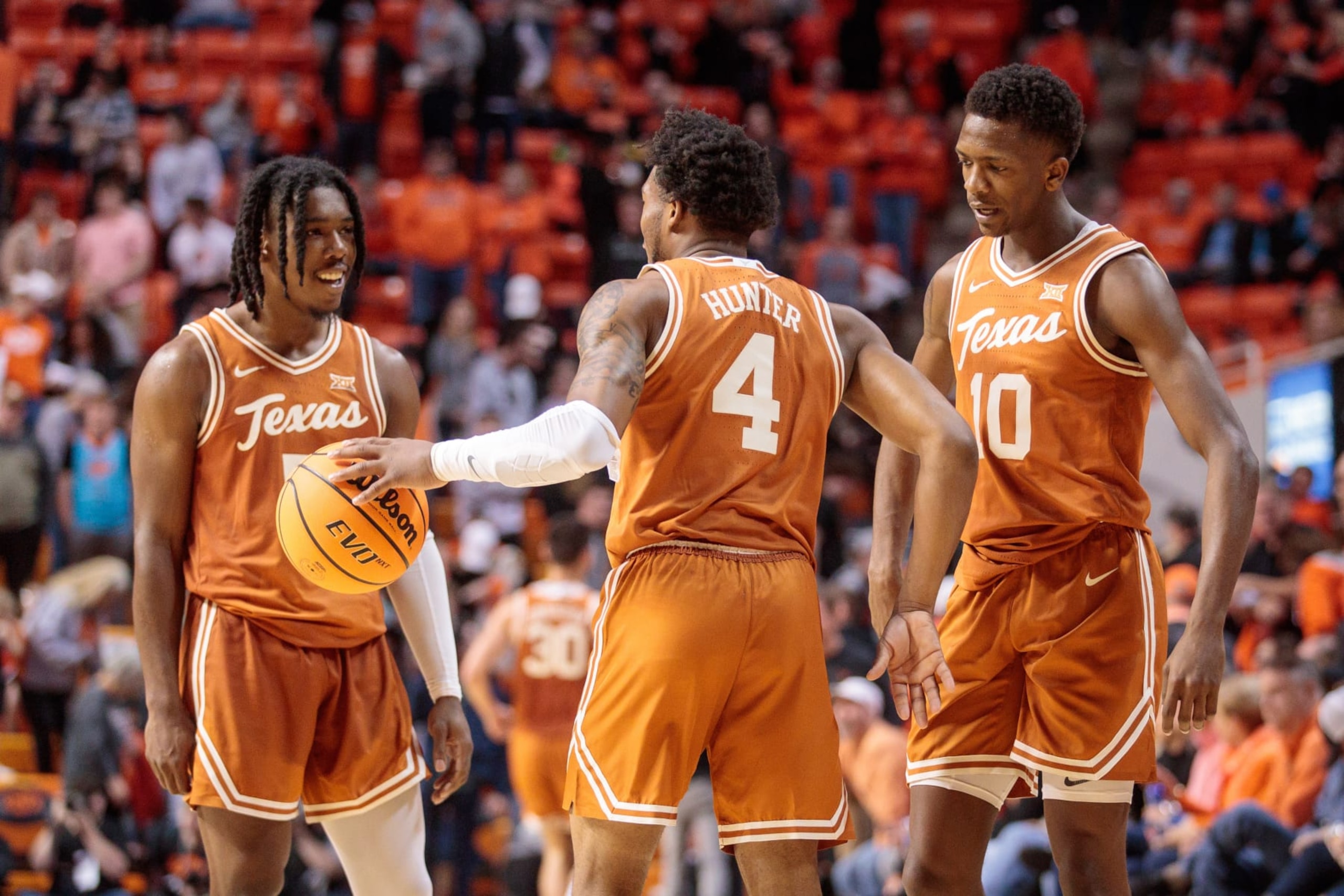 STILLWATER, OK - JANUARY 07: Texas Longhorns guard Marcus Carr (5) Texas Longhorns guard Tyrese Hunter (4) and Texas Longhorns guard Sir'Jabari Rice (10) react after winning the game against the Oklahoma State Cowboys on January 7th, 2023 at Gallagher Iba Arena in Stillwater, Oklahoma. (Photo by William Purnell/Icon Sportswire via Getty Images)
