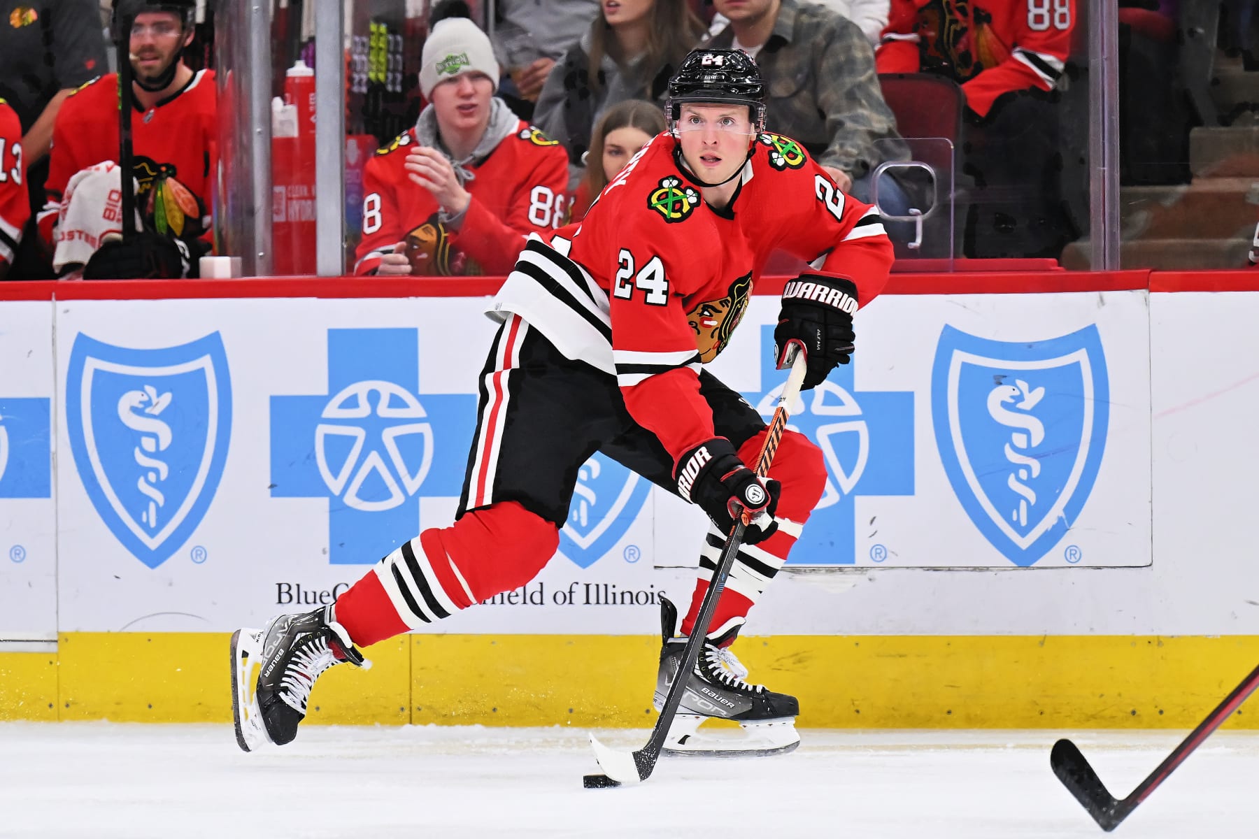 CHICAGO, ILLINOIS - DECEMBER 09:  Sam Lafferty #24 of the Chicago Blackhawks skates against the Winnipeg Jets on December 09, 2022 at United Center in Chicago, Illinois.  (Photo by Jamie Sabau/Getty Images)