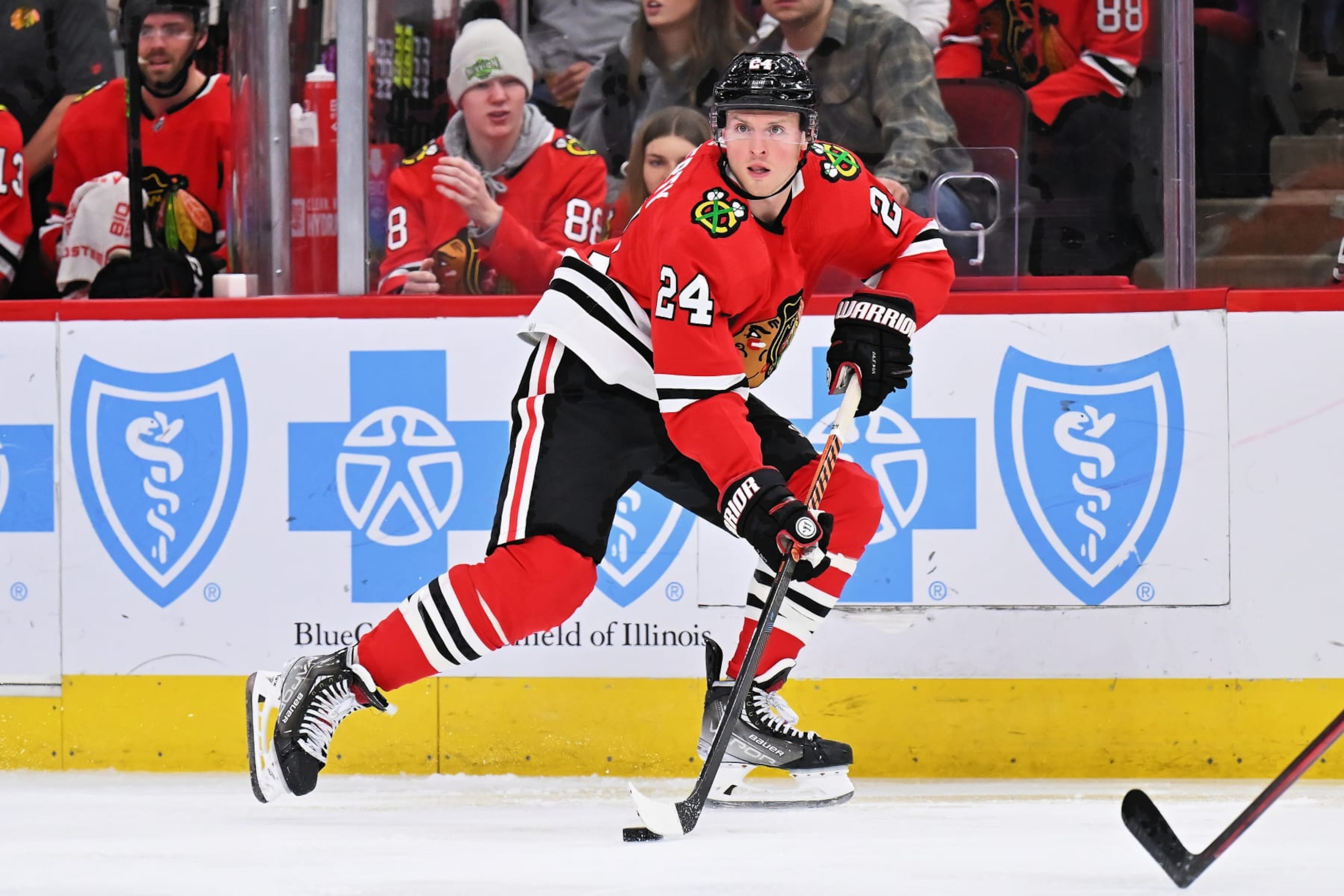 CHICAGO, ILLINOIS - DECEMBER 09:  Sam Lafferty #24 of the Chicago Blackhawks skates against the Winnipeg Jets on December 09, 2022 at United Center in Chicago, Illinois.  (Photo by Jamie Sabau/Getty Images)