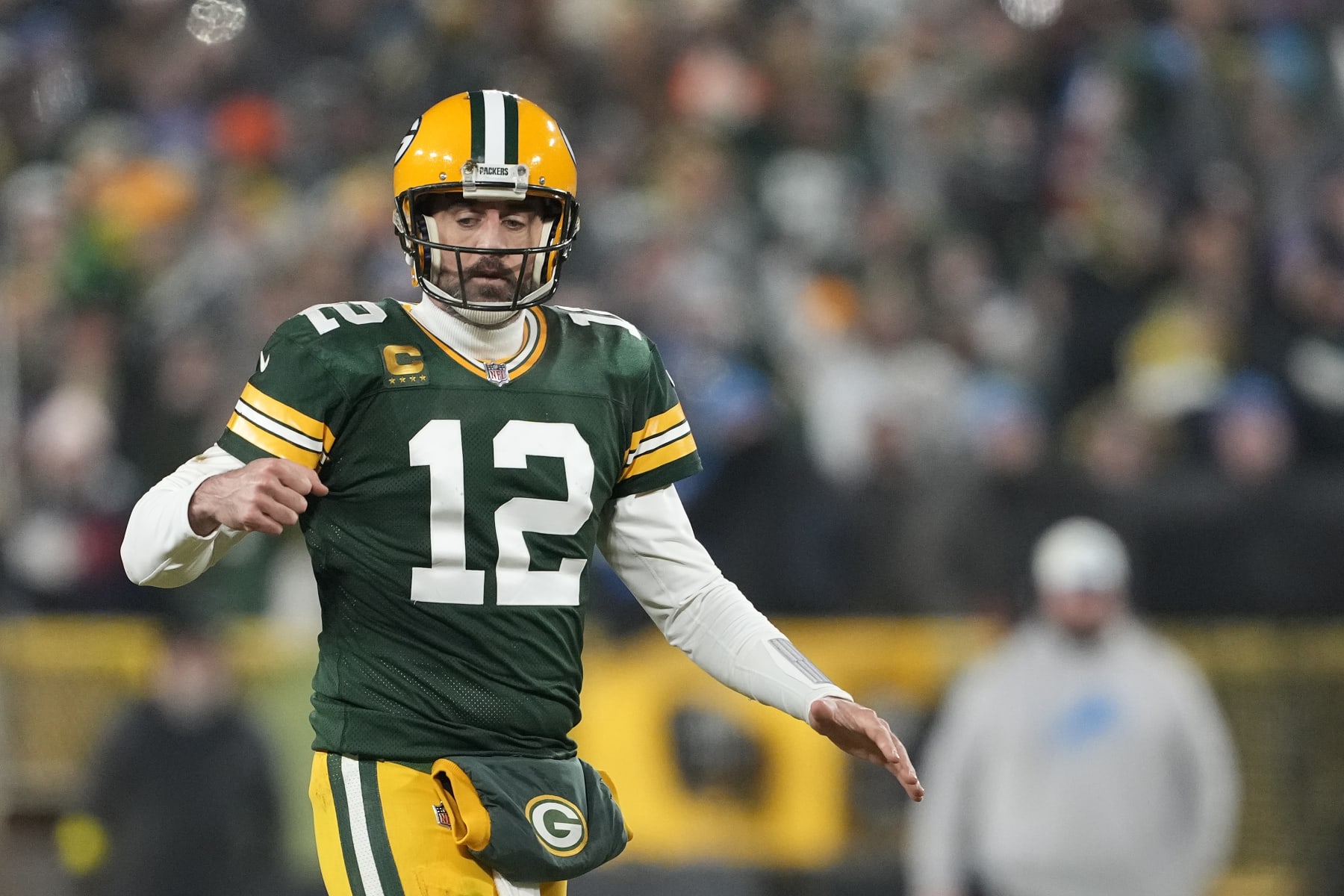 GREEN BAY, WISCONSIN - JANUARY 08: Aaron Rodgers #12 of the Green Bay Packers celebrates against the Detroit Lions in the second half at Lambeau Field on January 08, 2023 in Green Bay, Wisconsin. (Photo by Patrick McDermott/Getty Images)