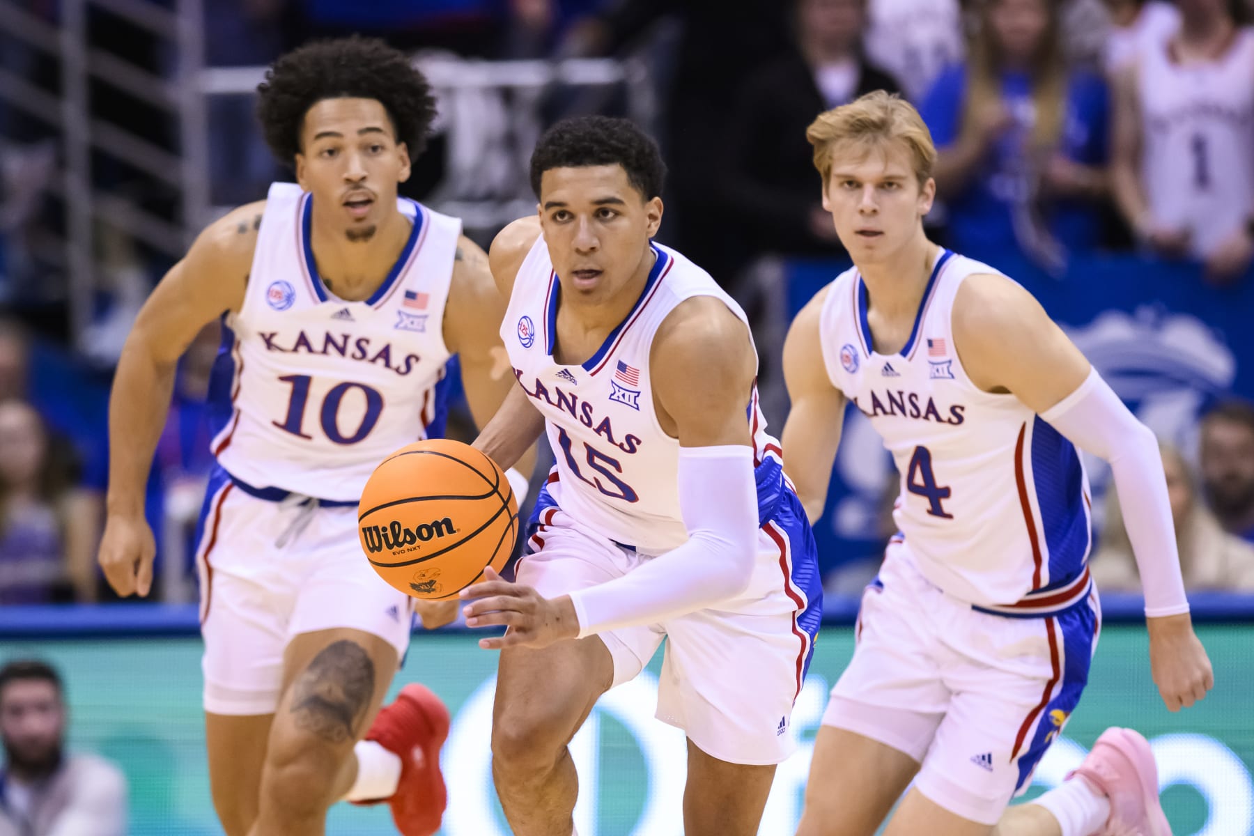 Kansas guard Kevin McCullar Jr. (15) brings the ball upcourt followed by forward Jalen Wilson (10) and guard Gradey Dick (4) during the first half of an NCAA college basketball game against Omaha in Lawrence, Kan., Monday, Nov. 7, 2022. (AP Photo/Reed Hoffmann)