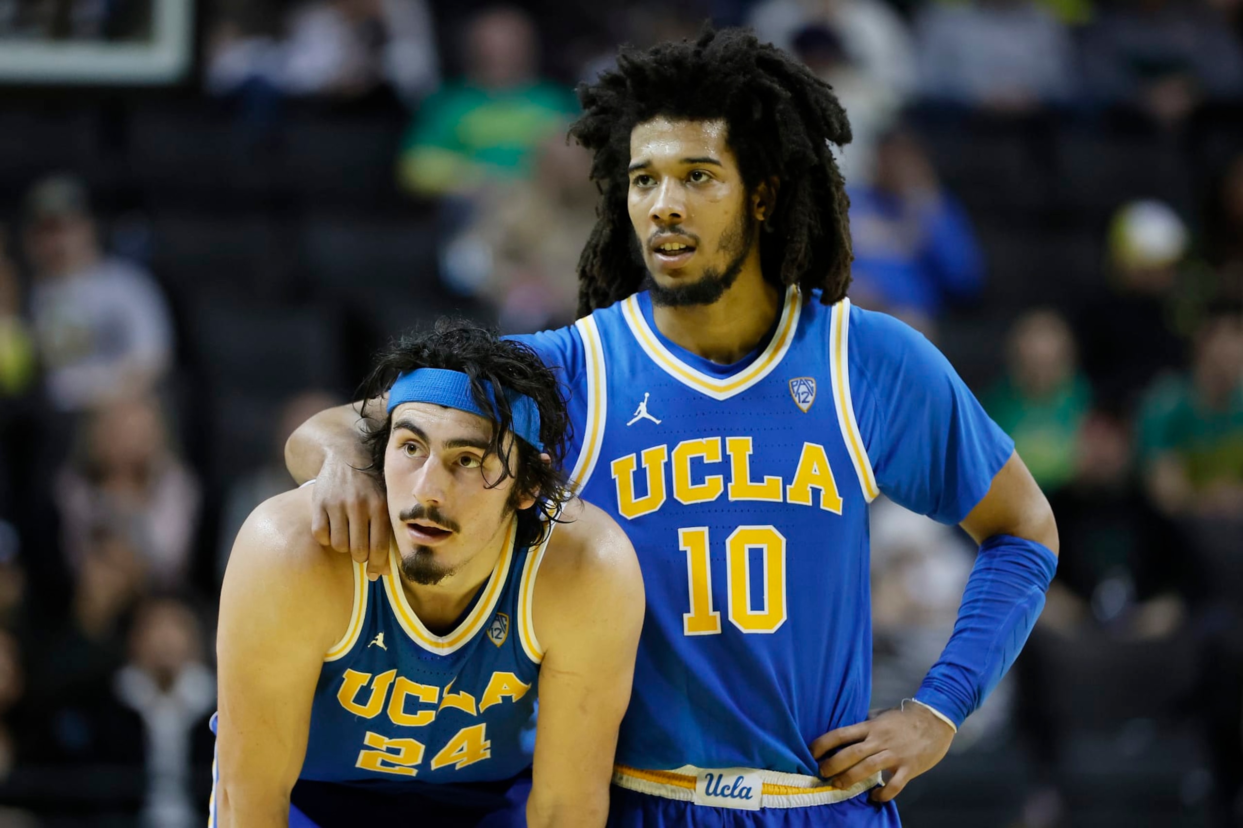 EUGENE, OREGON - FEBRUARY 11: Jaime Jaquez Jr. #24 looks on with Tyger Campbell #10 of the UCLA Bruins during the second half against the Oregon Ducks at Matthew Knight Arena on February 11, 2023 in Eugene, Oregon. (Photo by Soobum Im/Getty Images)