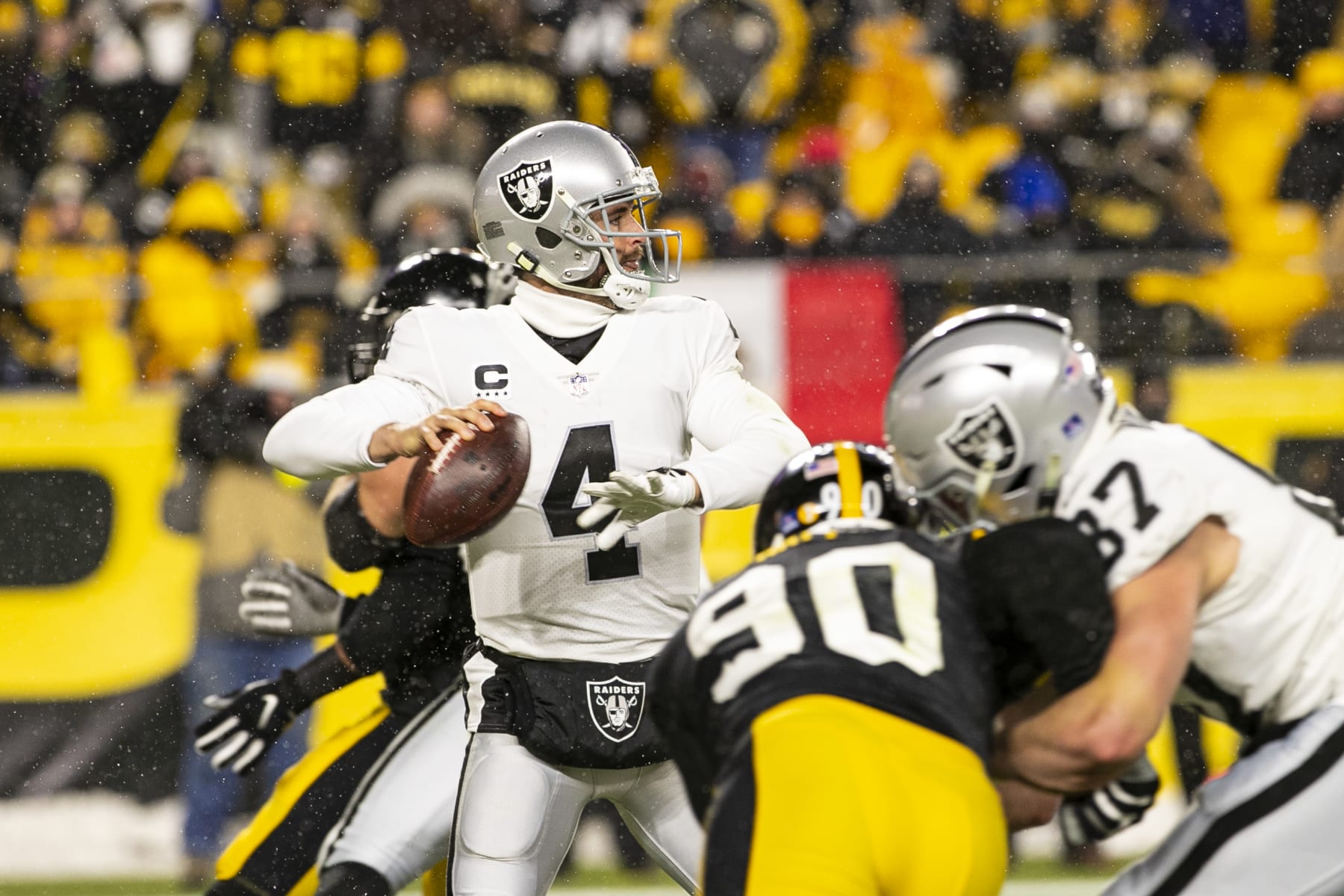 PITTSBURGH, PA - DECEMBER 24: Las Vegas Raiders quarterback Derek Carr (4) looks to pass during the national football league game between the Las Vegas Raiders and the Pittsburgh Steelers on December 24, 2022 at Acrisure Stadium in Pittsburgh, PA. (Photo by Mark Alberti/Icon Sportswire via Getty Images)