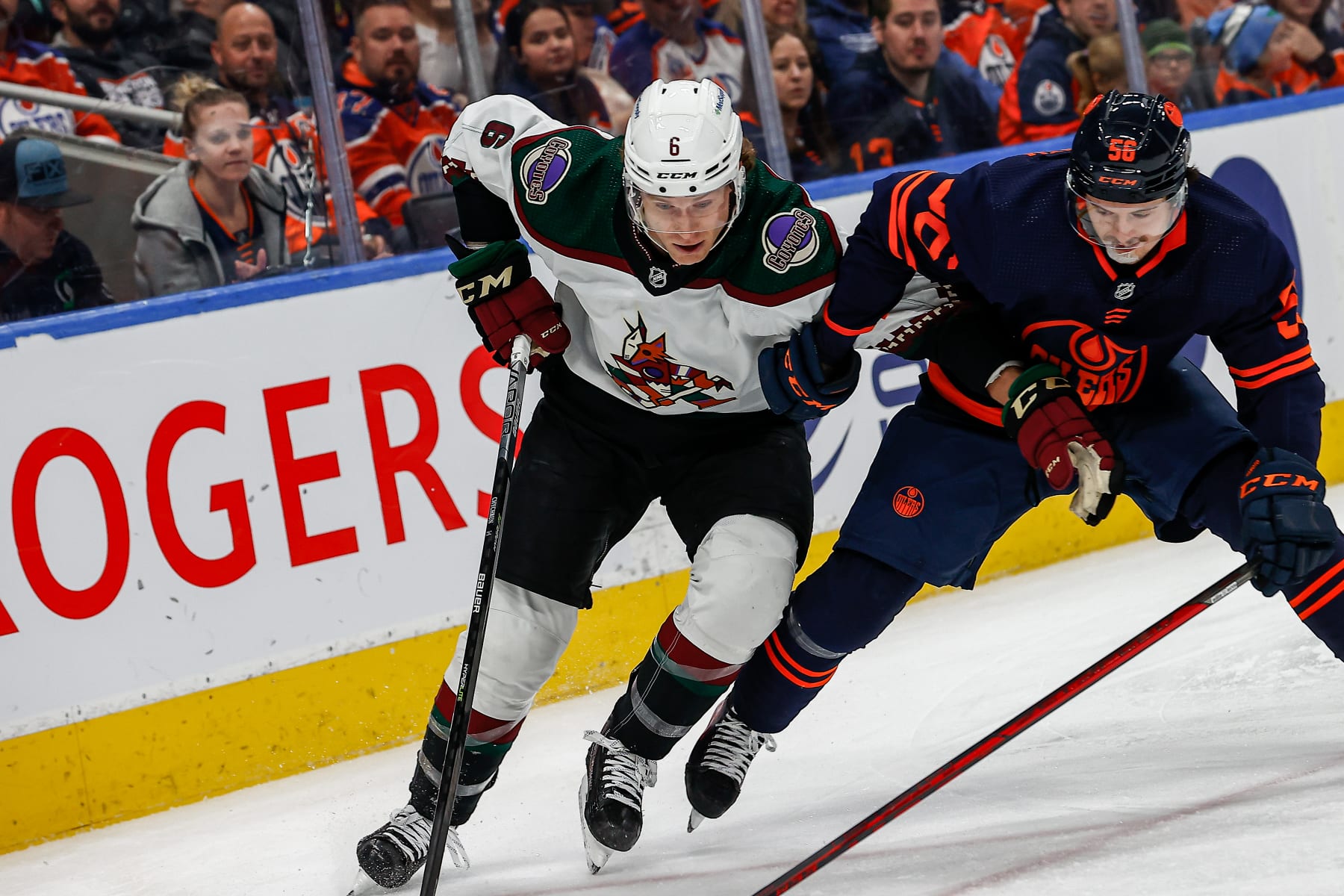 EDMONTON, AB - DECEMBER 7: Arizona Coyotes Defenceman Jakob Chychrun (6) fends off Edmonton Oilers Right Wing Kailer Yamamoto (56) in the first period during the Edmonton Oilers game versus the Arizona Coyotes on December 5, 2022 at Rogers Place in Edmonton, AB. (Photo by Curtis Comeau/Icon Sportswire via Getty Images)