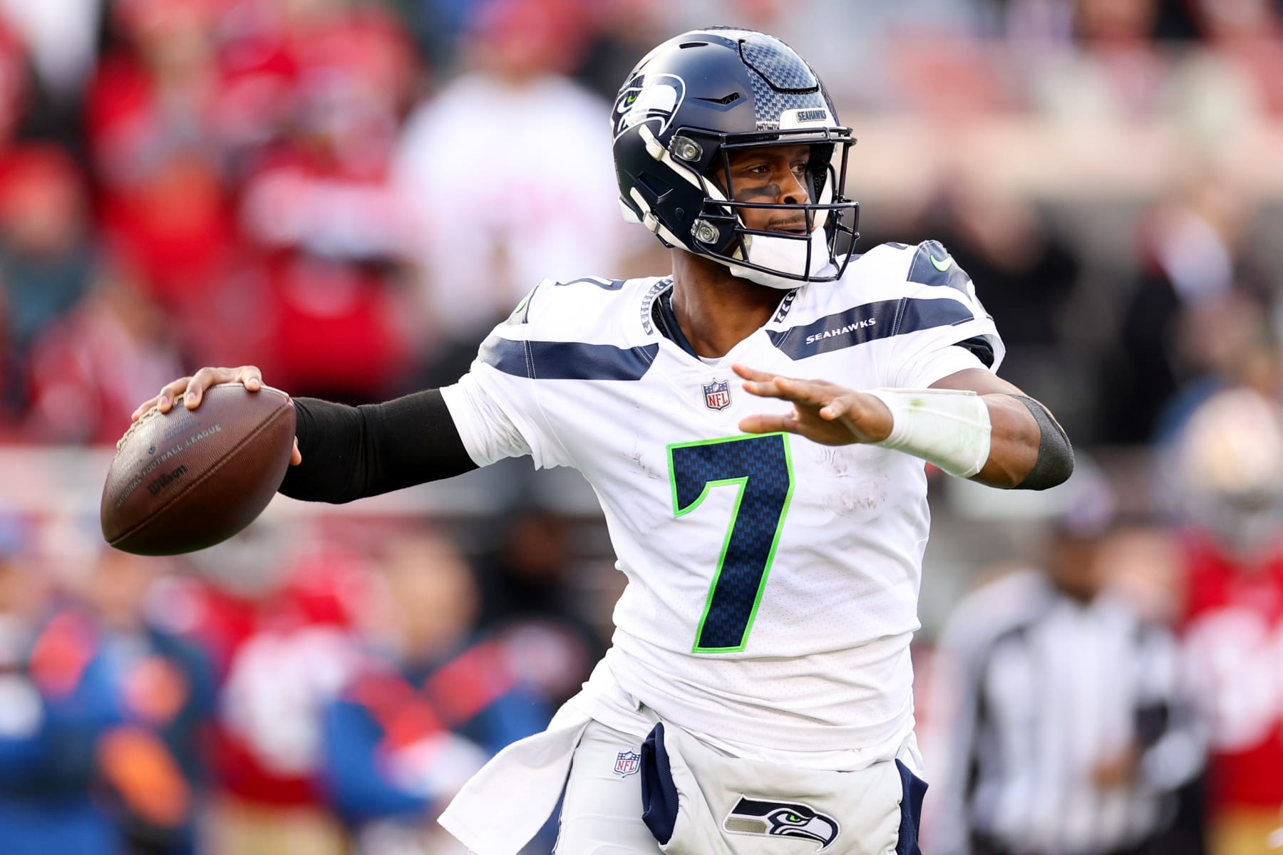 SANTA CLARA, CALIFORNIA - JANUARY 14: Geno Smith #7 of the Seattle Seahawks throws a pass against the San Francisco 49ers during the first half of the game in the NFC Wild Card playoff game at Levi's Stadium on January 14, 2023 in Santa Clara, California. (Photo by Ezra Shaw/Getty Images)