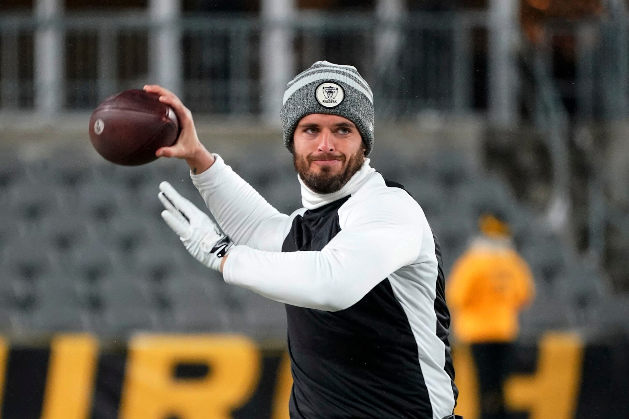 Las Vegas Raiders quarterback Derek Carr warms up before an NFL football game against the Pittsburgh Steelers in Pittsburgh, Saturday, Dec. 24, 2022. (AP Photo/Gene J. Puskar)