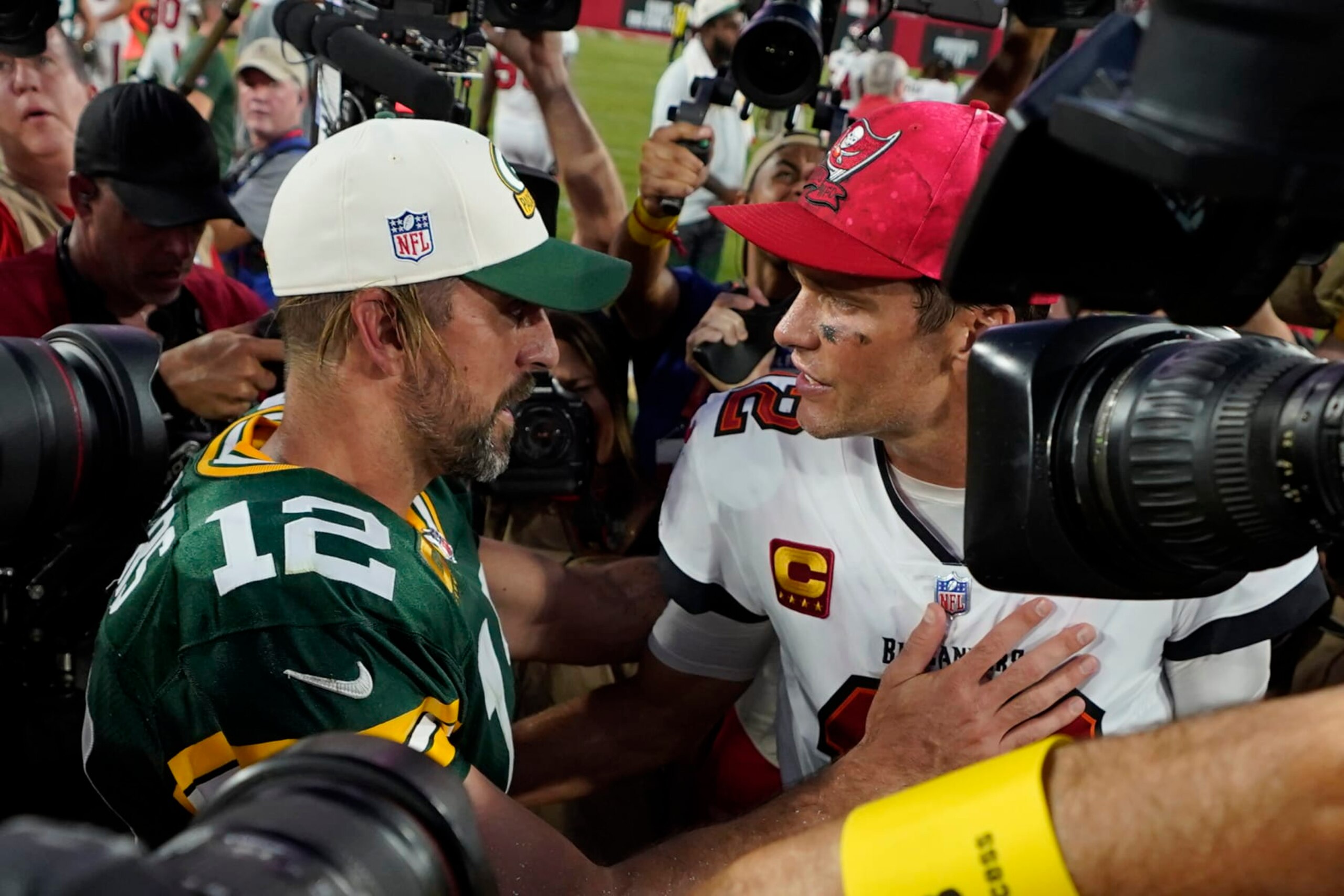 Green Bay Packers quarterback Aaron Rodgers (12) and Tampa Bay Buccaneers quarterback Tom Brady (12) after an NFL football game Sunday, Sept. 25, 2022, in Tampa, Fla. (AP Photo/Chris O'Meara)