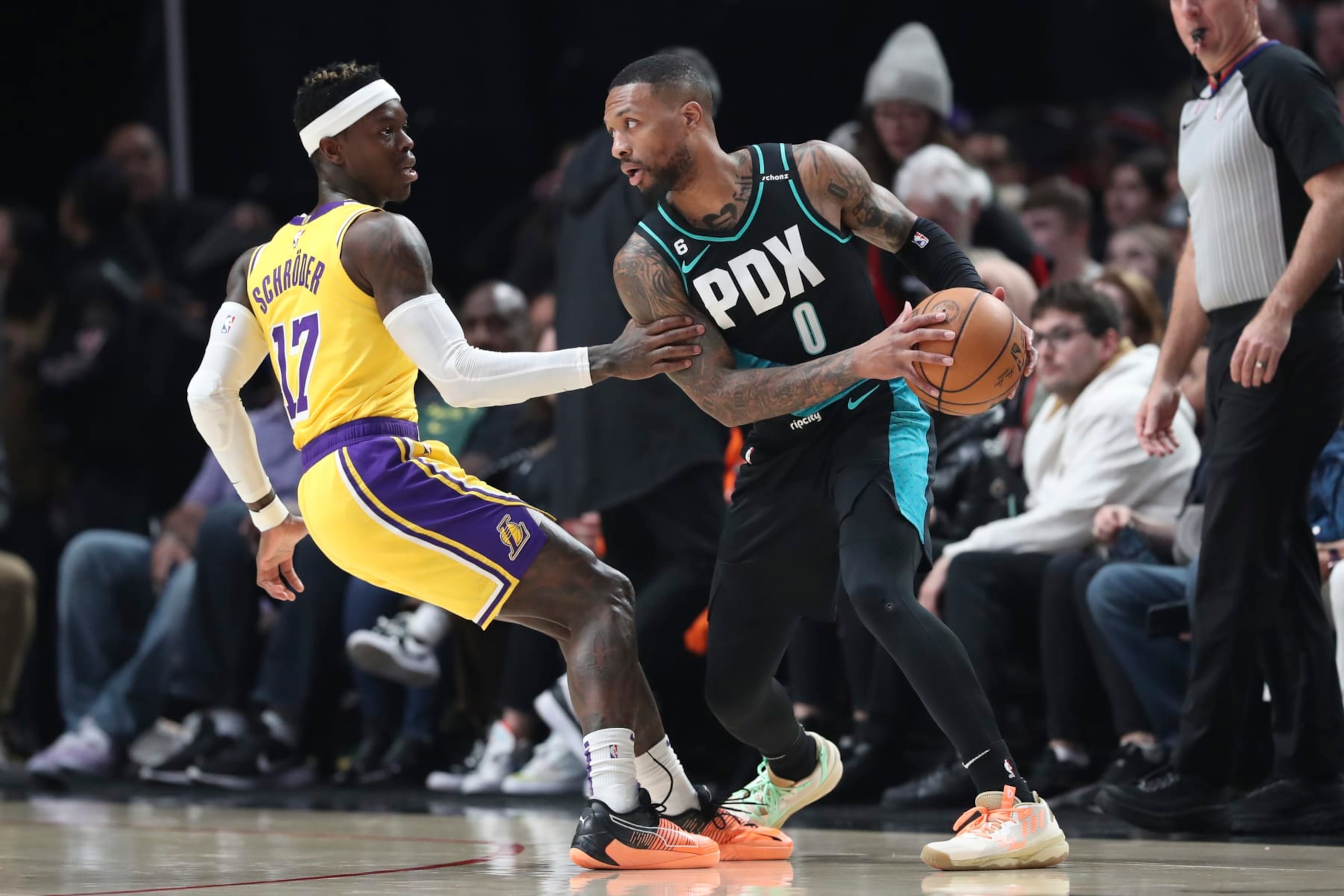 PORTLAND, OREGON - FEBRUARY 13: Dennis Schroder #17 of the Los Angeles Lakers defends against Damian Lillard #0 of the Portland Trail Blazers during the first quarter at Moda Center on February 13, 2023 in Portland, Oregon. NOTE TO USER: User expressly acknowledges and agrees that, by downloading and or using this photograph, user is consenting to the terms and conditions of the Getty Images License Agreement. (Photo by Amanda Loman/Getty Images) PORTLAND, OREGON - FEBRUARY 13: Dennis Schroder #17 of the Los Angeles Lakers defends against Damian Lillard #0 of the Portland Trail Blazers during the first quarter at Moda Center on February 13, 2023 in Portland, Oregon. NOTE TO USER: User expressly acknowledges and agrees that, by downloading and or using this photograph, user is consenting to the terms and conditions of the Getty Images License Agreement. (Photo by Amanda Loman/Getty Images)