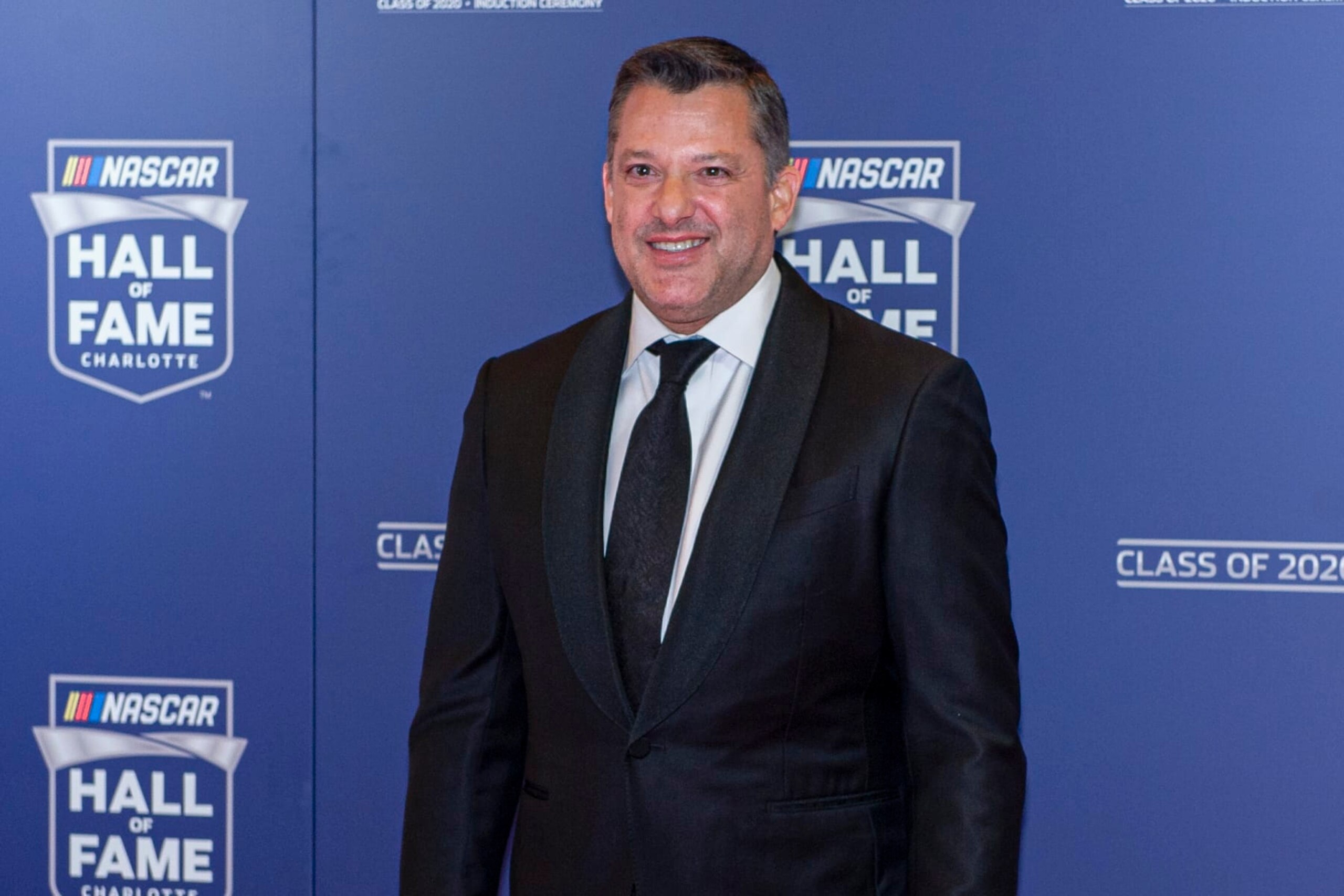 FILE - NASCAR Hall of Fame inductee Tony Stewart poses for pictures prior to the induction ceremony in Charlotte, N.C., in this Friday, Jan. 31, 2020, file photo. Tony Stewart wants to set the record straight about two misconstrued recent business decisions. Fans have been critical of Stewart since the Truck Series was dropped from Eldora Speedway and because he didn't sign Kyle Larson to his NASCAR team. Stewart is adamant that he tried to sign Larson but couldn't get partner approval on the driver suspended for using a racial slur. And he insists he dropped NASCAR after he felt slighted that Bristol Motor Speedway was given a Cup race on dirt. (AP Photo/Mike McCarn, File)