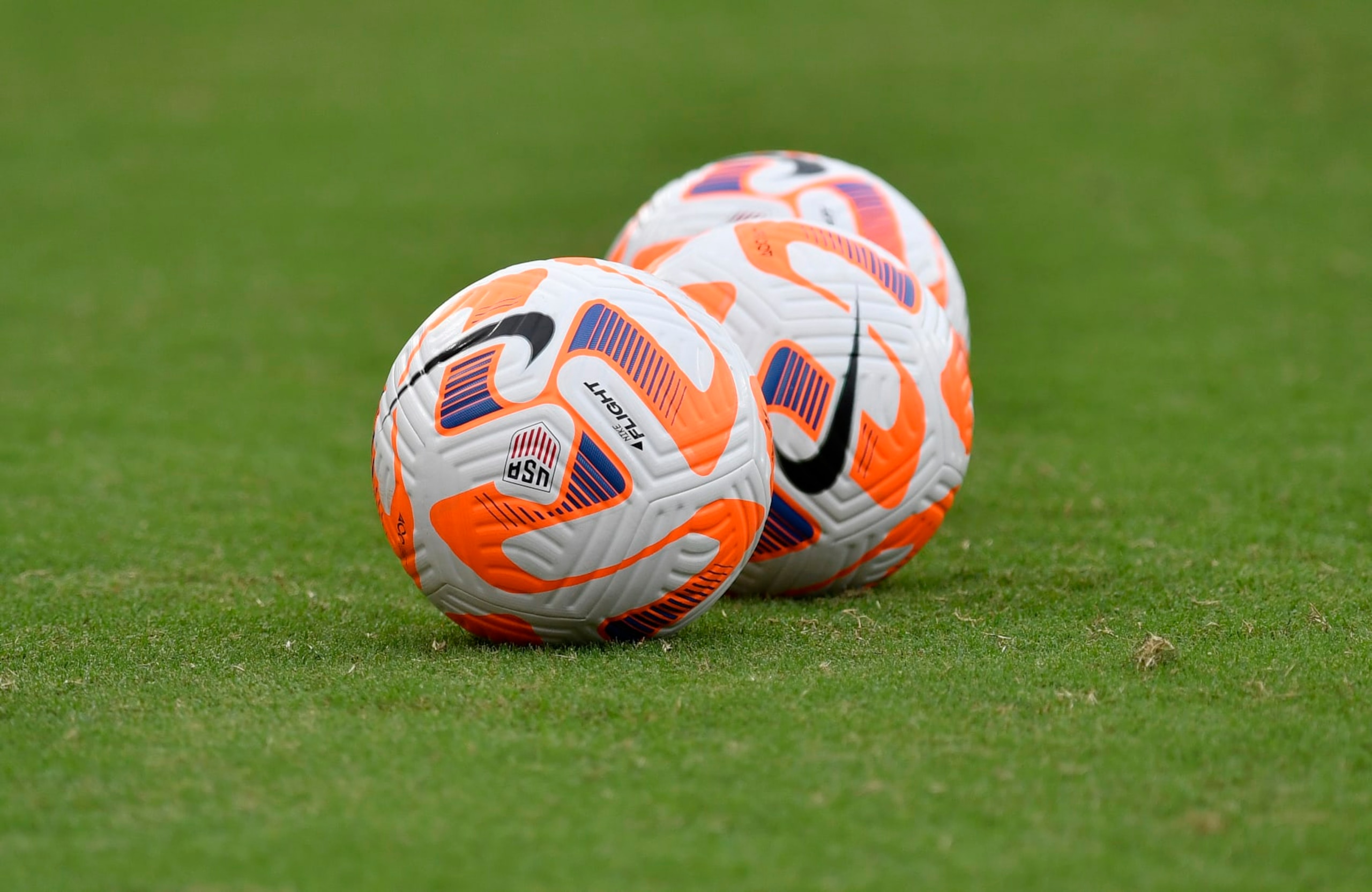 WASHINGTON, DC - SEPTEMBER 06: A close up view of Nike Flight soccer balls on a natural grass field during the Nigeria versus United States Womens National Team (USWNT USA) game on September 06, 2022, at Audi Field in Washington, D.C.. (Photo by Randy Litzinger/Icon Sportswire via Getty Images)