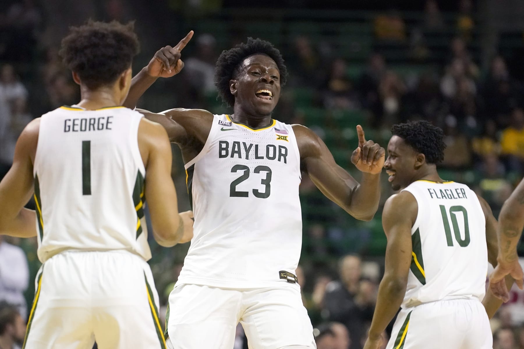 Baylor forward Jonathan Tchamwa Tchatchoua (23) celebrates after a score with teammate Keyonte George (1) during the first half of an NCAA college basketball game against West Virginia in Waco, Texas, Monday, Feb. 13, 2023. (AP Photo/LM Otero)