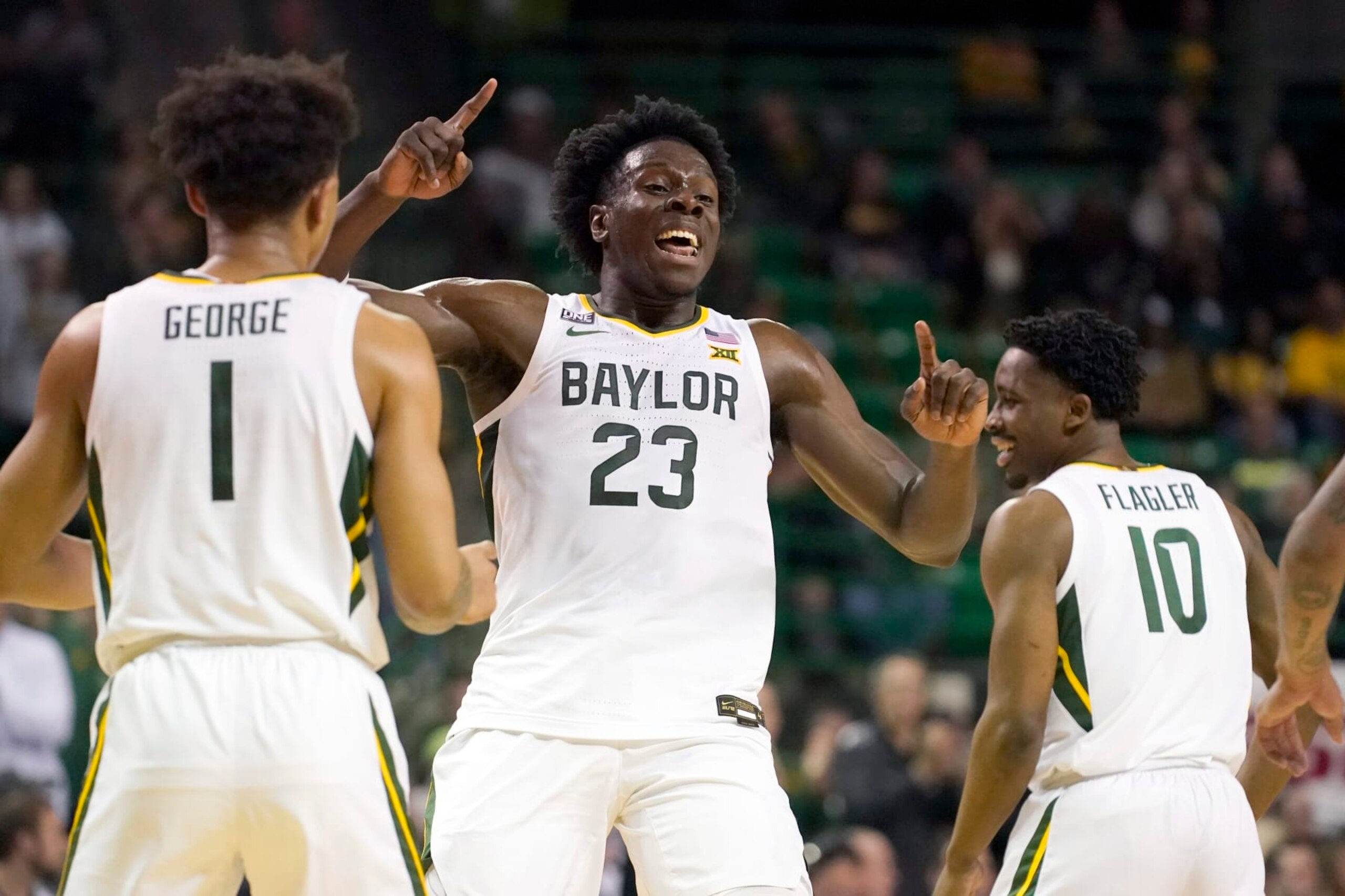 Baylor forward Jonathan Tchamwa Tchatchoua (23) celebrates after a score with teammate Keyonte George (1) during the first half of an NCAA college basketball game against West Virginia in Waco, Texas, Monday, Feb. 13, 2023. (AP Photo/LM Otero)