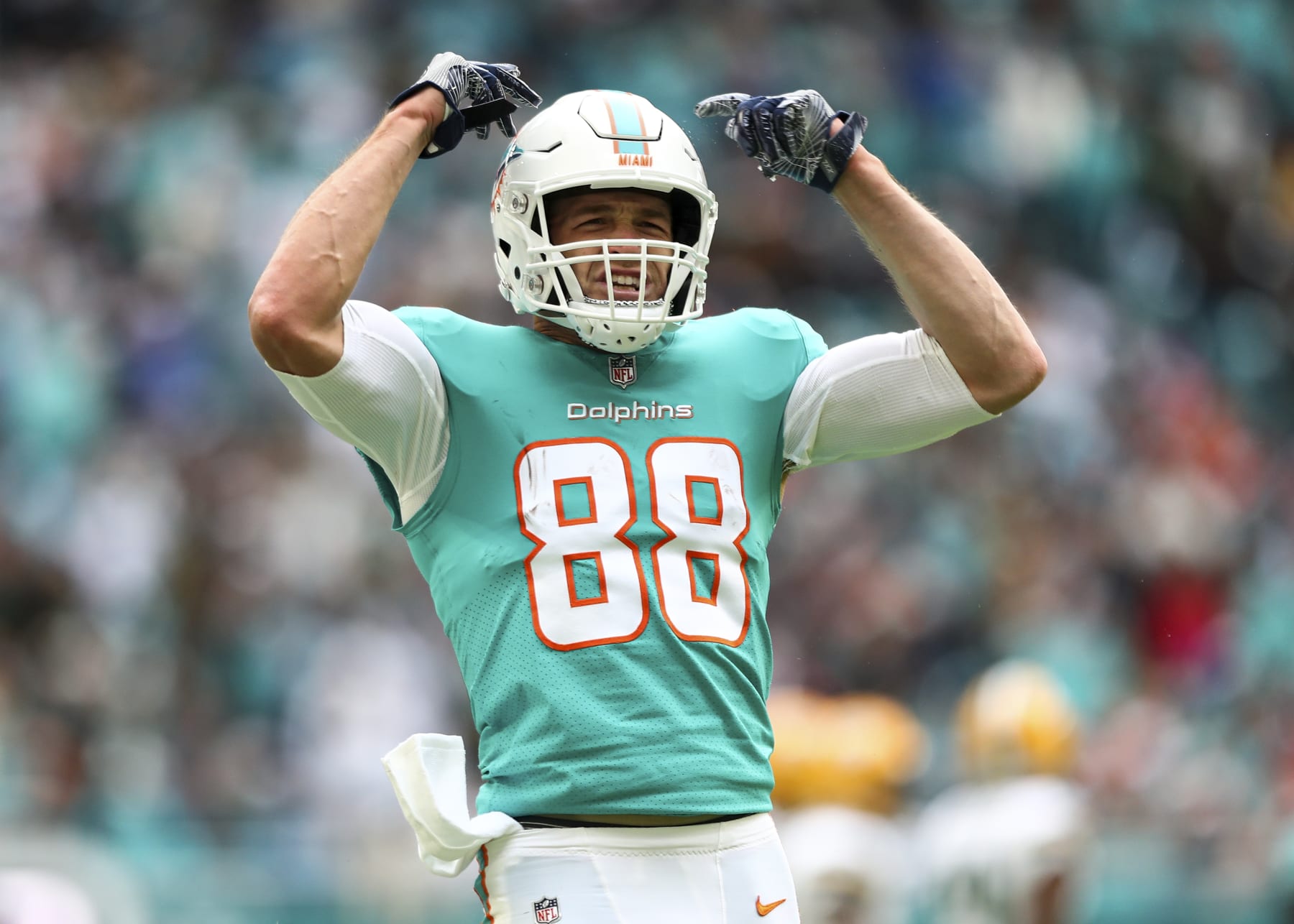 MIAMI GARDENS, FL - DECEMBER 25: Mike Gesicki #88 of the Miami Dolphins celebrates after a play during the second quarter of an NFL football game against the Green Bay Packers at Hard Rock Stadium on December 25, 2022 in Miami Gardens, Florida. (Photo by Kevin Sabitus/Getty Images)