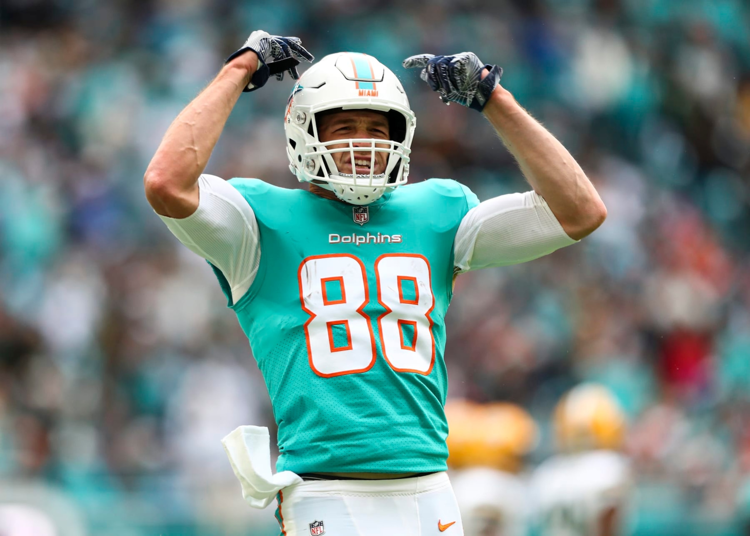 MIAMI GARDENS, FL - DECEMBER 25: Mike Gesicki #88 of the Miami Dolphins celebrates after a play during the second quarter of an NFL football game against the Green Bay Packers at Hard Rock Stadium on December 25, 2022 in Miami Gardens, Florida. (Photo by Kevin Sabitus/Getty Images)