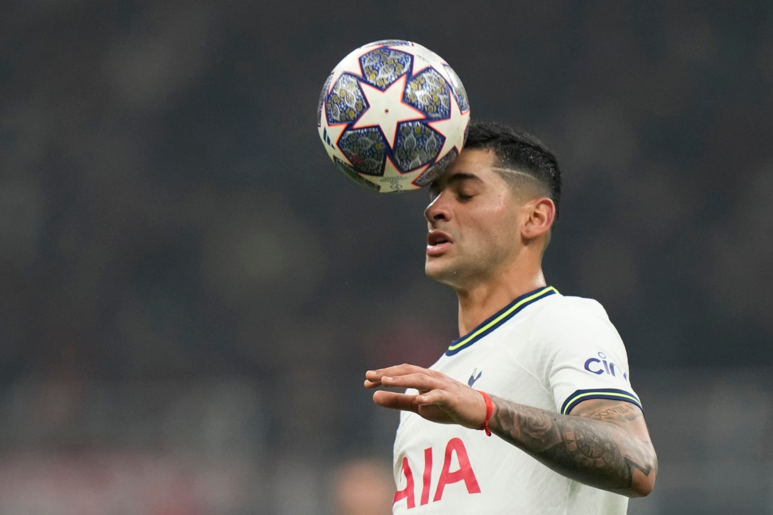 Tottenham's Cristian Romero heads the ball during the Champions League, round of 16, first leg soccer match between AC Milan and Tottenham Hotspur at the San Siro stadium in Milan , Italy, Tuesday, Feb. 14, 2023. (AP Photo/Luca Bruno) Tottenham's Cristian Romero heads the ball during the Champions League, round of 16, first leg soccer match between AC Milan and Tottenham Hotspur at the San Siro stadium in Milan , Italy, Tuesday, Feb. 14, 2023. (AP Photo/Luca Bruno)