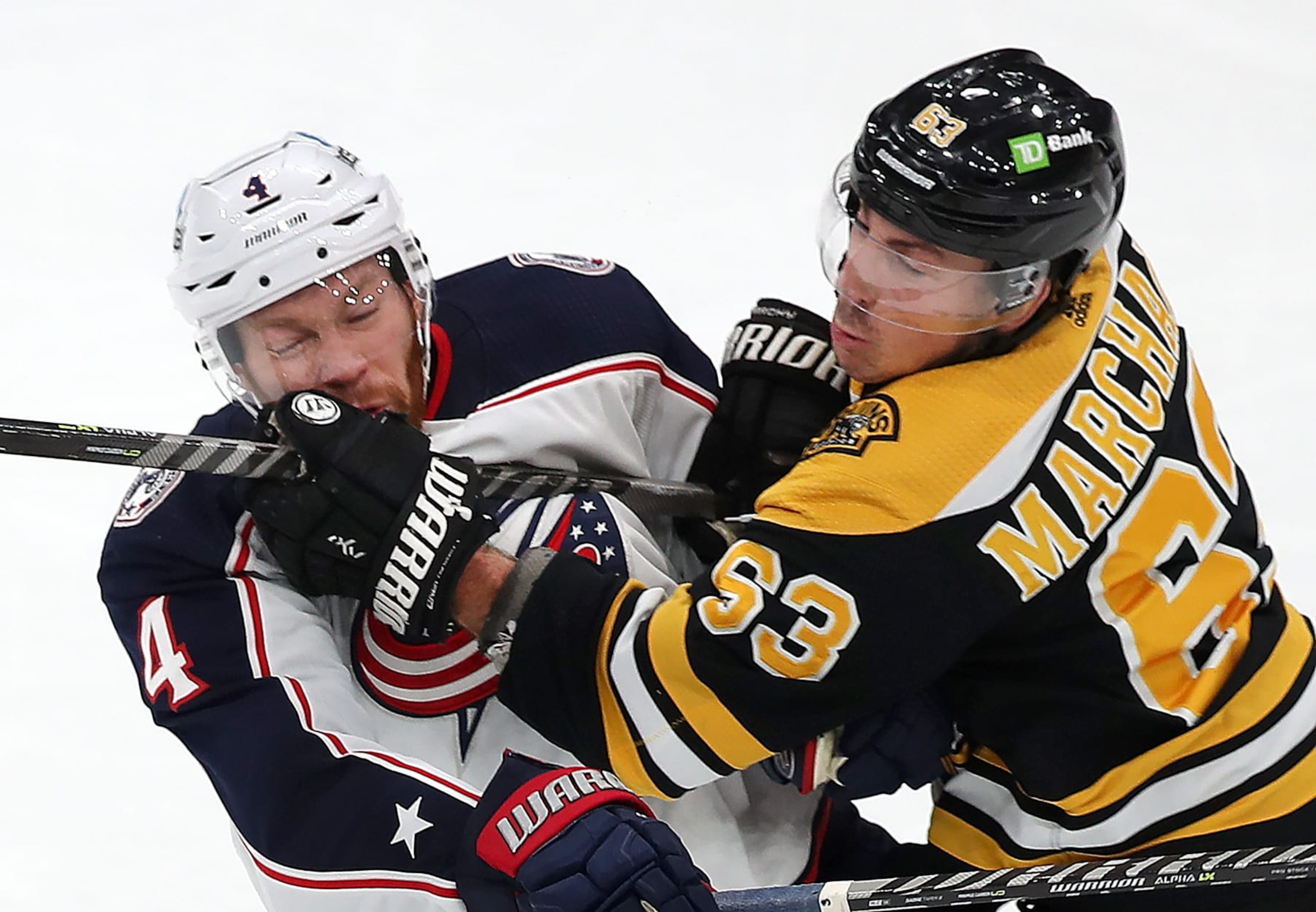 Boston, MA - December 17: Boston Bruins LW Brad Marchand slams into the chest of Columbus Blue Jackets D Vladislav Gavrikov. The Bruins beat the Blue Jackets 4-2. (Photo by John Tlumacki/The Boston Globe via Getty Images) Boston, MA - December 17: Boston Bruins LW Brad Marchand slams into the chest of Columbus Blue Jackets D Vladislav Gavrikov. The Bruins beat the Blue Jackets 4-2. (Photo by John Tlumacki/The Boston Globe via Getty Images)