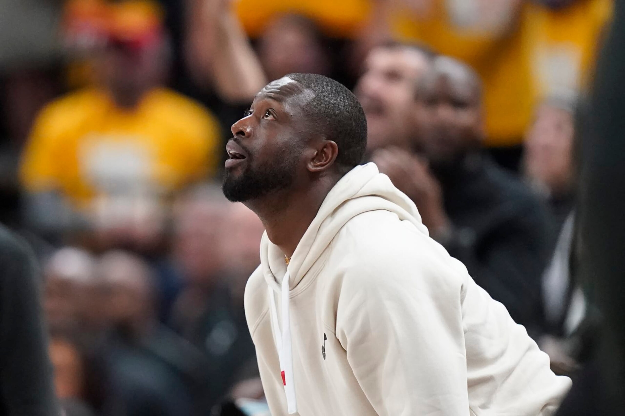 Dwyane Wade, minority owner of the Utah Jazz, looks at the scoreboard in the second half of Game 4 of an NBA basketball first-round playoff series against the Dallas Mavericks Saturday, April 23, 2022, in Salt Lake City. (AP Photo/Rick Bowmer)