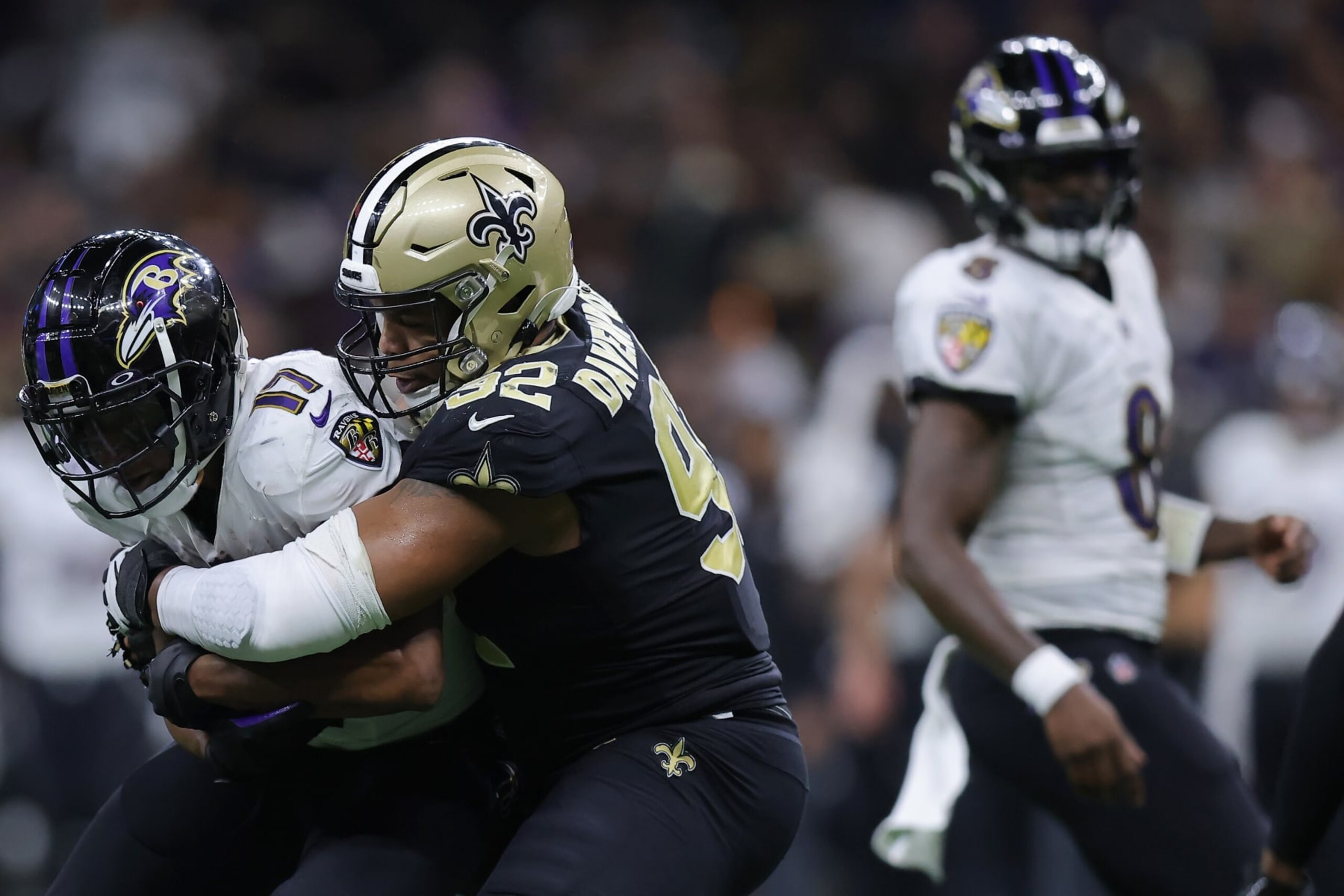 NEW ORLEANS, LOUISIANA - NOVEMBER 07: Kenyan Drake #17 of the Baltimore Ravens is tackled by Marcus Davenport #92 of the New Orleans Saints during the third quarter at Caesars Superdome on November 07, 2022 in New Orleans, Louisiana. (Photo by Jonathan Bachman/Getty Images)