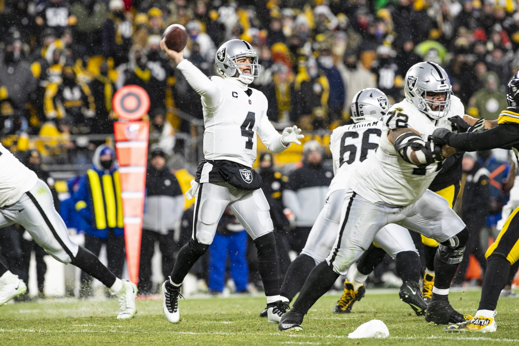 PITTSBURGH, PA - DECEMBER 24: Las Vegas Raiders quarterback Derek Carr (4) throws a pass during the national football league game between the Las Vegas Raiders and the Pittsburgh Steelers on December 24, 2022 at Acrisure Stadium in Pittsburgh, PA. (Photo by Mark Alberti/Icon Sportswire via Getty Images)