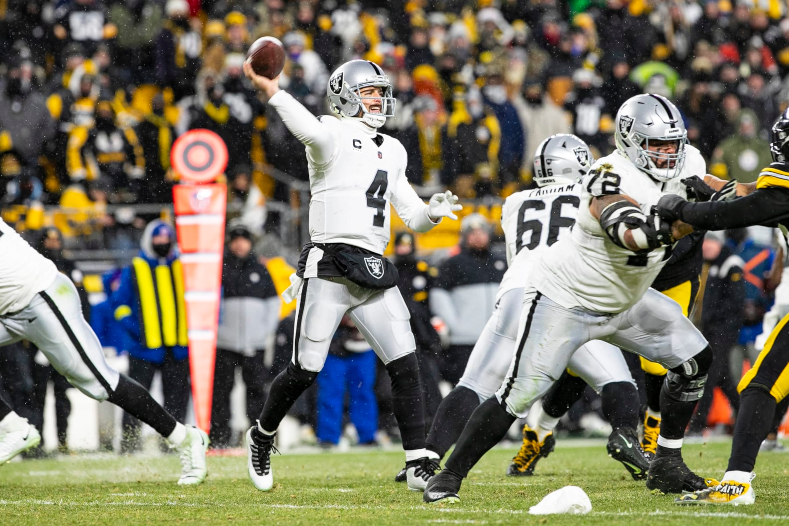 PITTSBURGH, PA - DECEMBER 24: Las Vegas Raiders quarterback Derek Carr (4) throws a pass during the national football league game between the Las Vegas Raiders and the Pittsburgh Steelers on December 24, 2022 at Acrisure Stadium in Pittsburgh, PA. (Photo by Mark Alberti/Icon Sportswire via Getty Images)