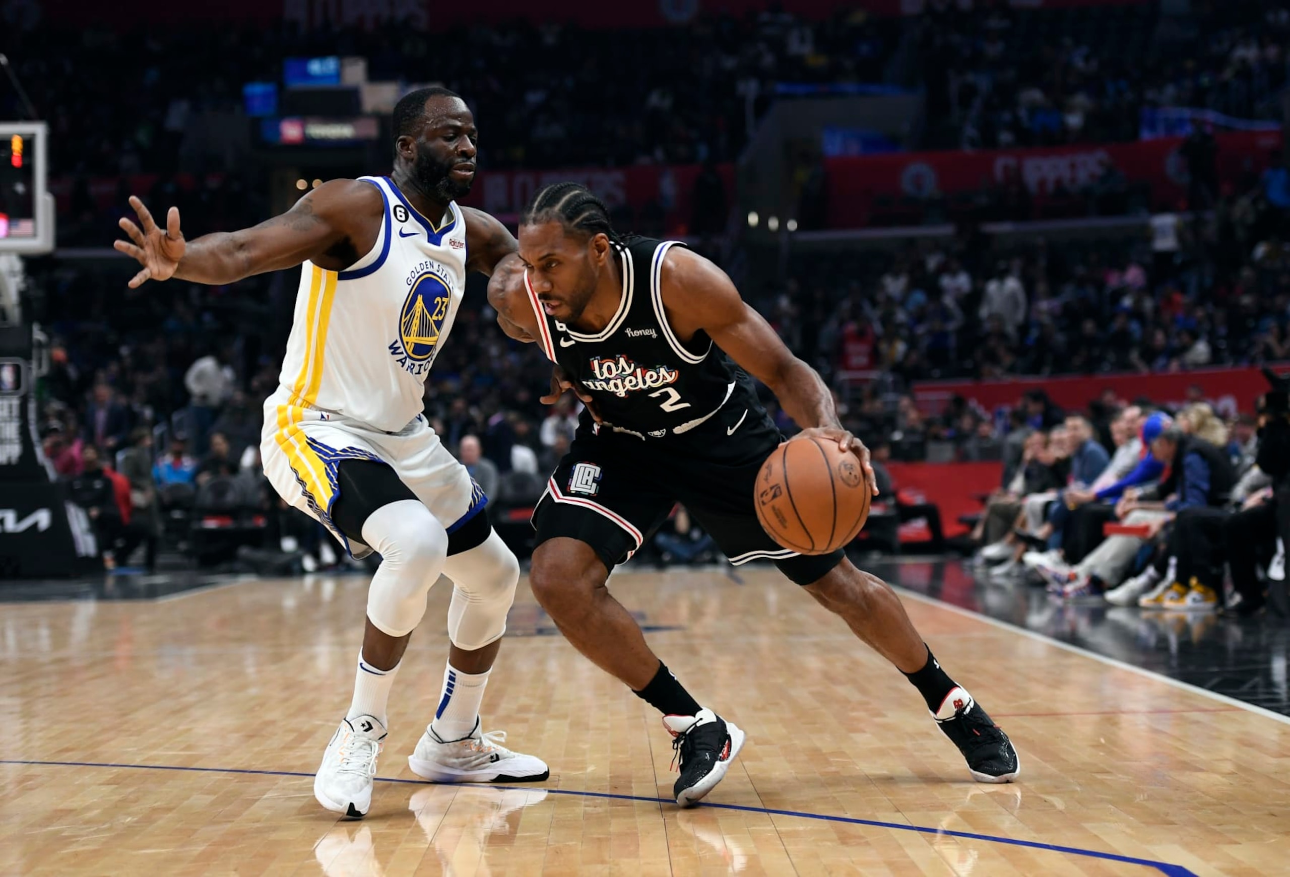 LOS ANGELES, CA - FEBRUARY 14: Kawhi Leonard #2 of the Los Angeles Clippers drives against Draymond Green #23 of the Golden State Warriors during the first half at Crypto.com Arena on February 14, 2023 in Los Angeles, California. NOTE TO USER: User expressly acknowledges and agrees that, by downloading and or using this photograph, User is consenting to the terms and conditions of the Getty Images License Agreement. (Photo by Kevork Djansezian/Getty Images) LOS ANGELES, CA - FEBRUARY 14: Kawhi Leonard #2 of the Los Angeles Clippers drives against Draymond Green #23 of the Golden State Warriors during the first half at Crypto.com Arena on February 14, 2023 in Los Angeles, California. NOTE TO USER: User expressly acknowledges and agrees that, by downloading and or using this photograph, User is consenting to the terms and conditions of the Getty Images License Agreement. (Photo by Kevork Djansezian/Getty Images)