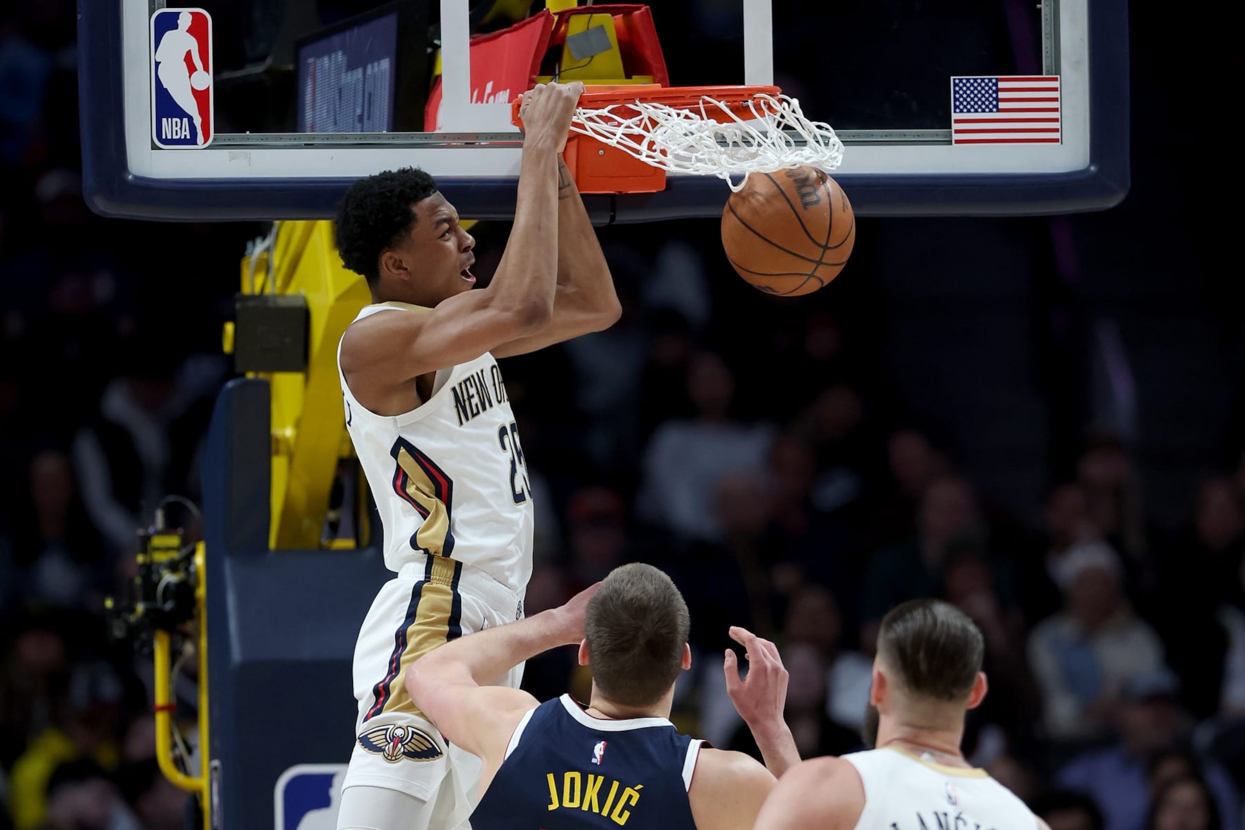 DENVER, COLORADO - JANUARY 31: Trey Murphy III #25 of the New Orleans Pelicans dunks against Nikola Jokic #15 of the Denver Nuggets in the first quarter at Ball Arena on January 31, 2023 in Denver, Colorado. NOTE TO USER: User expressly acknowledges and agrees that, by downloading and/or using this photograph, User is consenting to the terms and conditions of the Getty Images License Agreement. (Photo by Matthew Stockman/Getty Images) DENVER, COLORADO - JANUARY 31: Trey Murphy III #25 of the New Orleans Pelicans dunks against Nikola Jokic #15 of the Denver Nuggets in the first quarter at Ball Arena on January 31, 2023 in Denver, Colorado. NOTE TO USER: User expressly acknowledges and agrees that, by downloading and/or using this photograph, User is consenting to the terms and conditions of the Getty Images License Agreement. (Photo by Matthew Stockman/Getty Images)